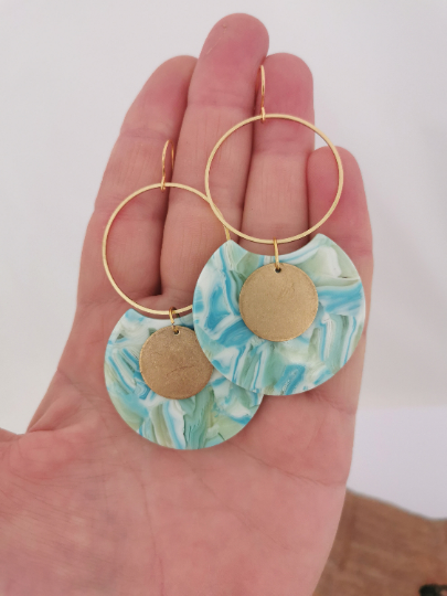 Very large acrylic and bronze statement earrings.