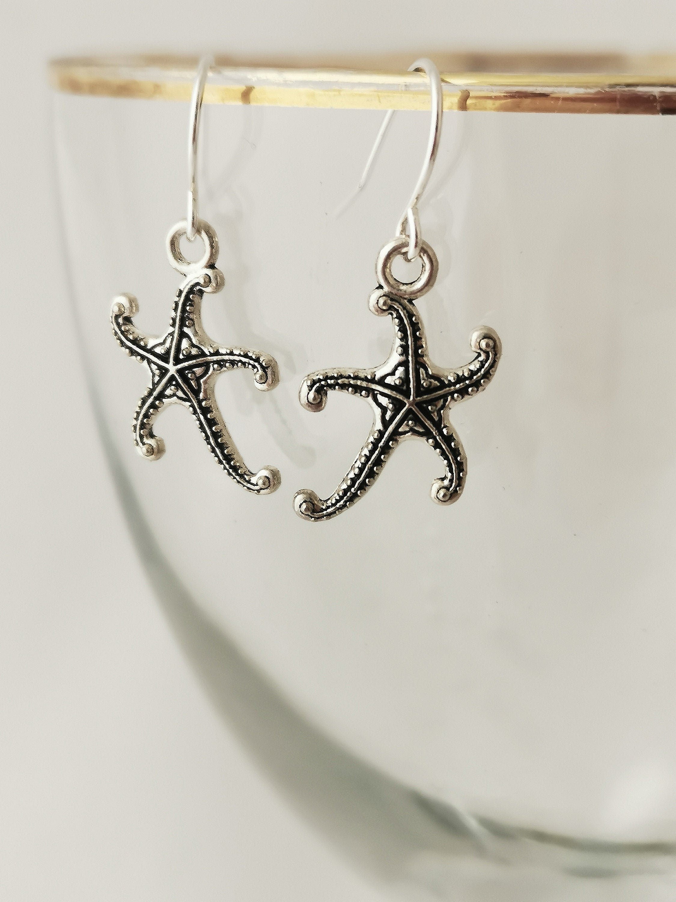 Dangly silver starfish earrings. Hypoallergenic, nickel free