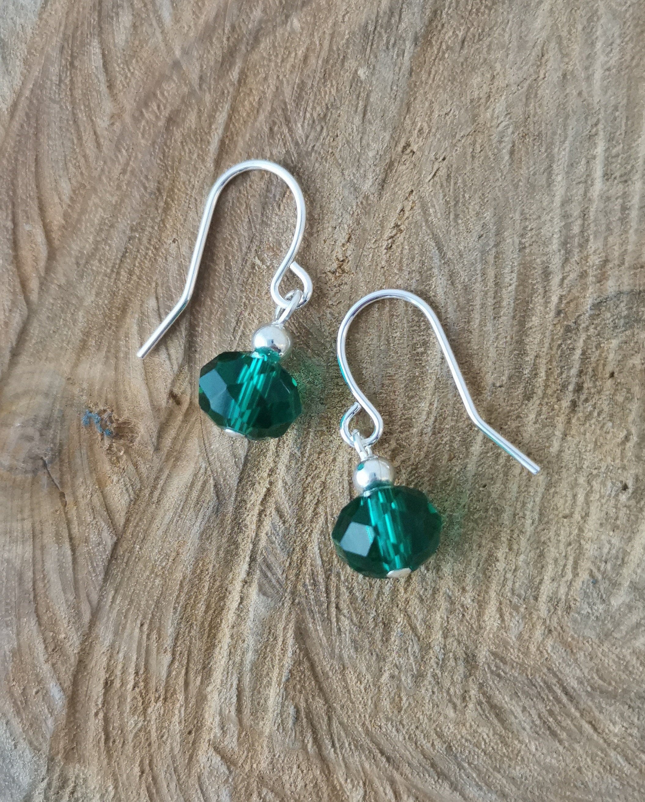 Small teal faceted glass earrings. Hypoallergenic and nickel free.