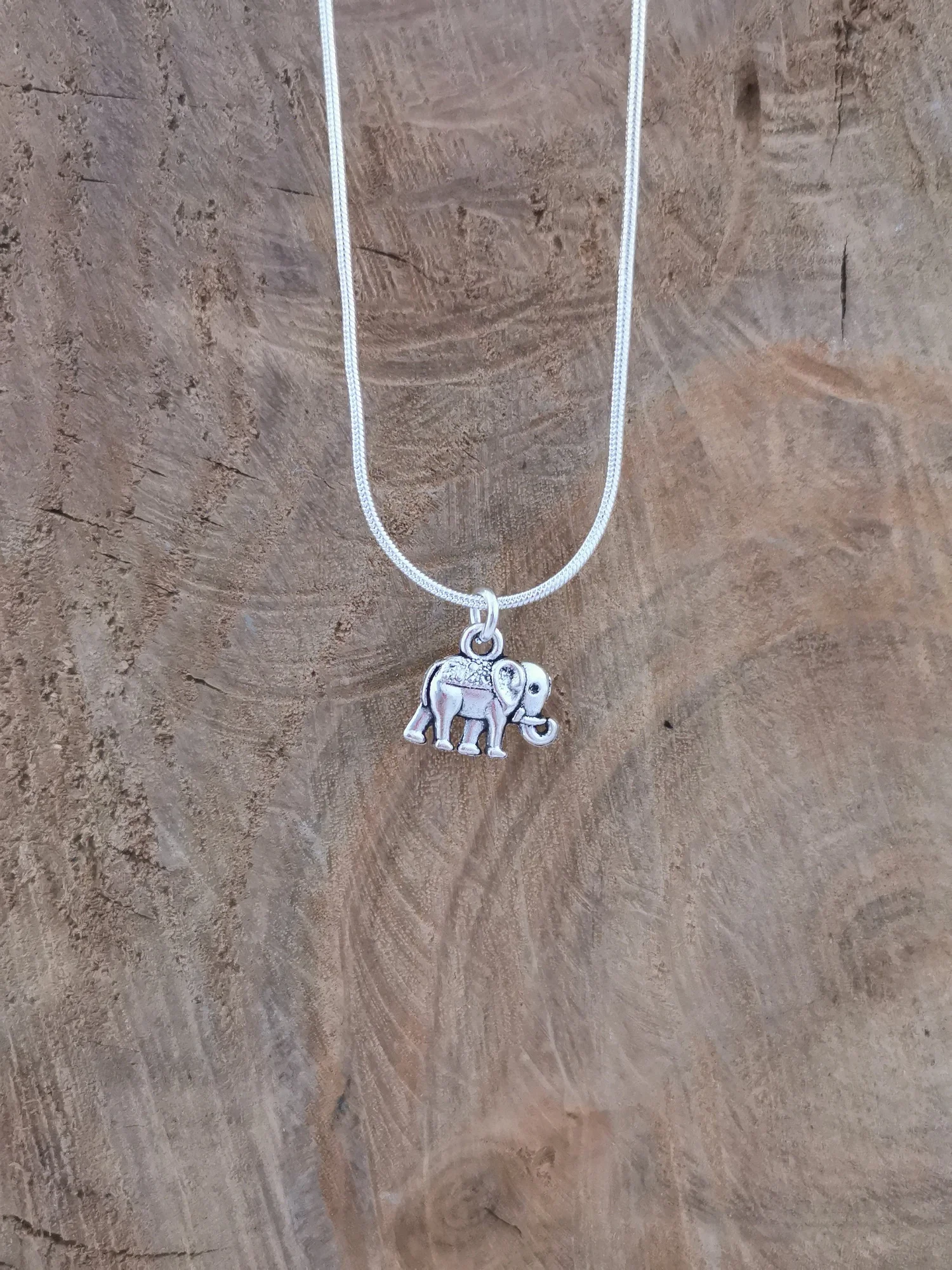 Simple silver elephant Silver plated pendant on silver