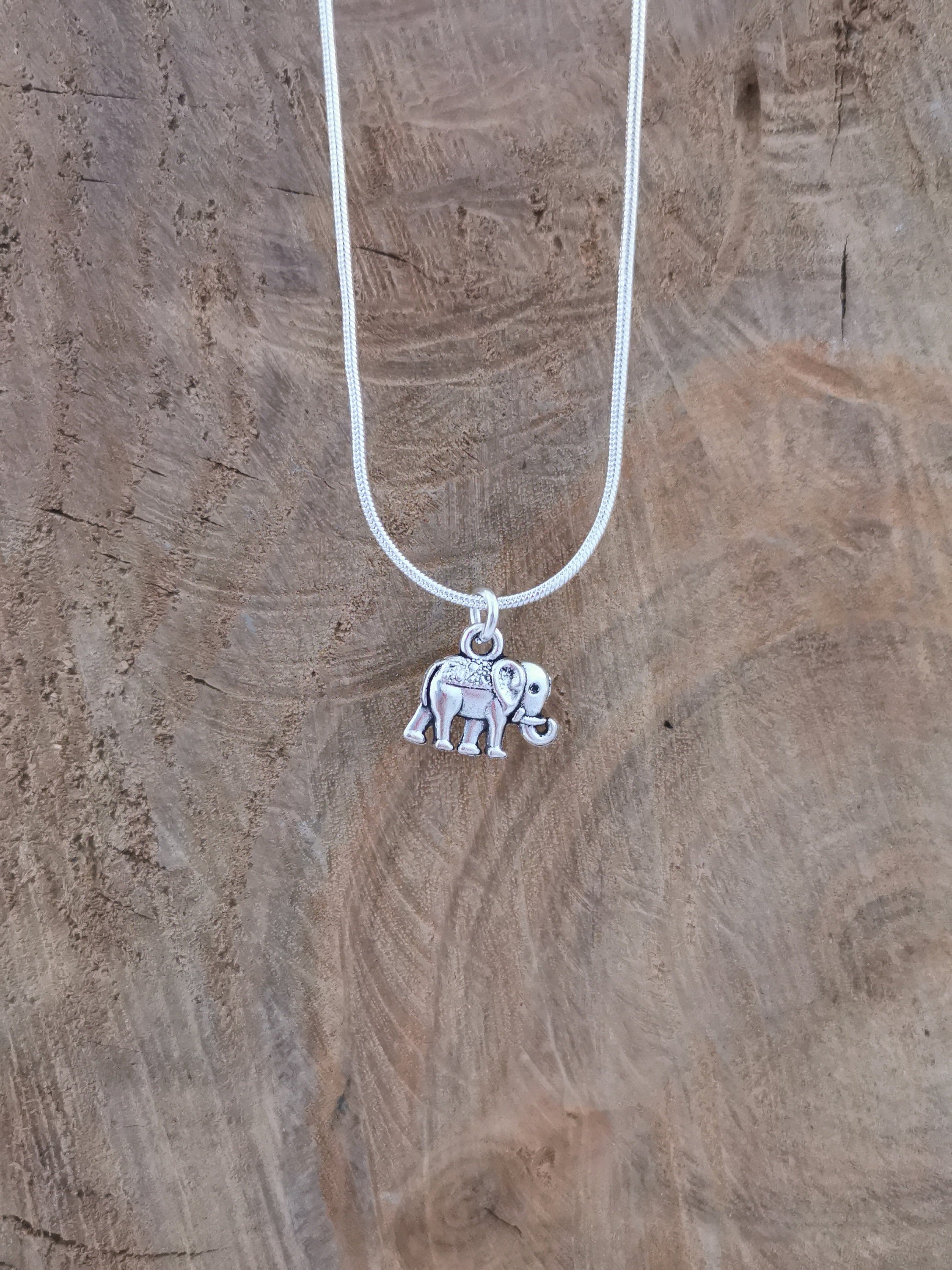 Simple silver elephant necklace. Silver plated pendant on silver plated snake chain. 18 inches.