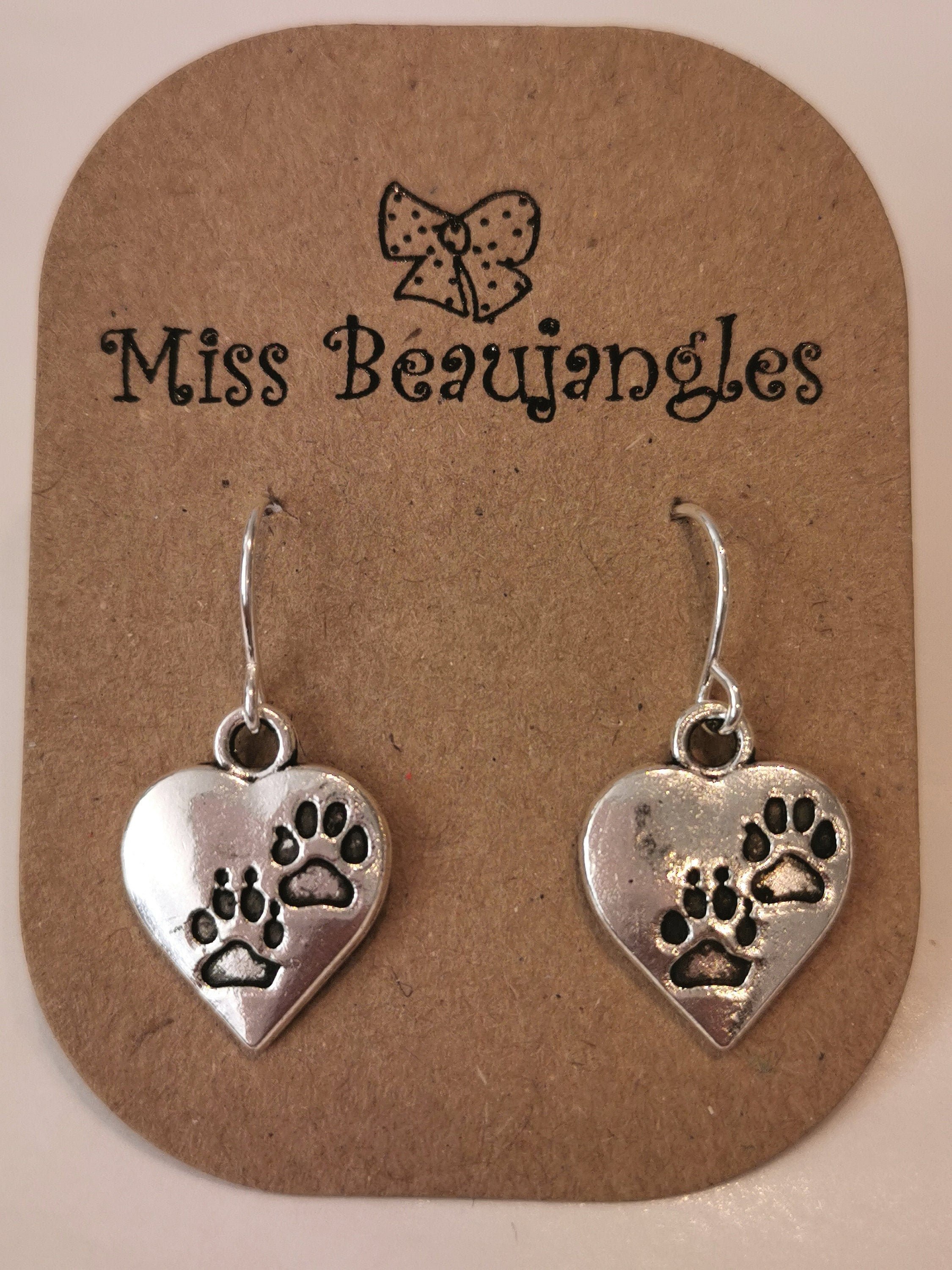 Silver paw print earrings. Paw print hearts. Silver plated, nickel free, hypoallergenic
