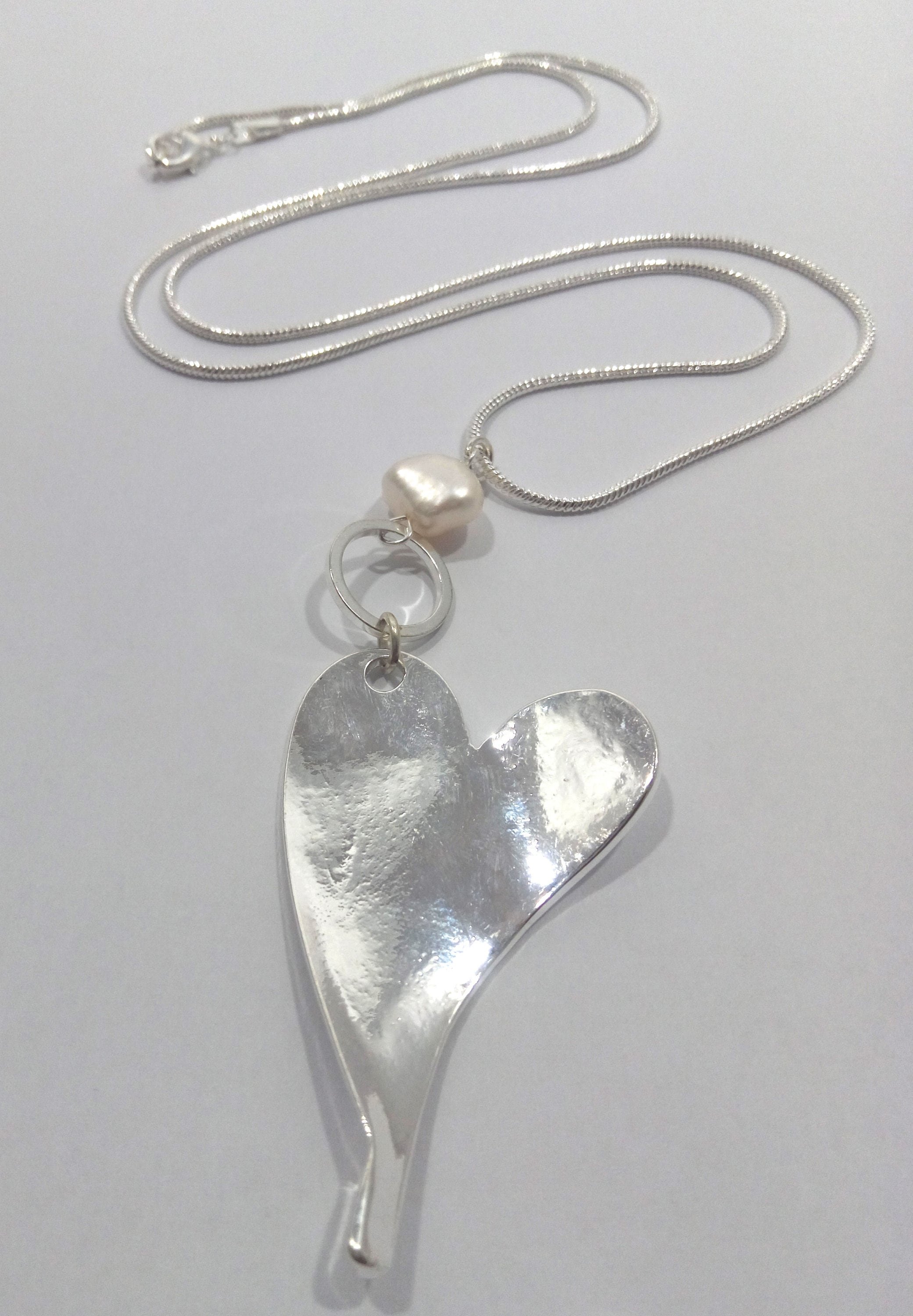 Long heart and freshwater pearl pendant on a snake chain
