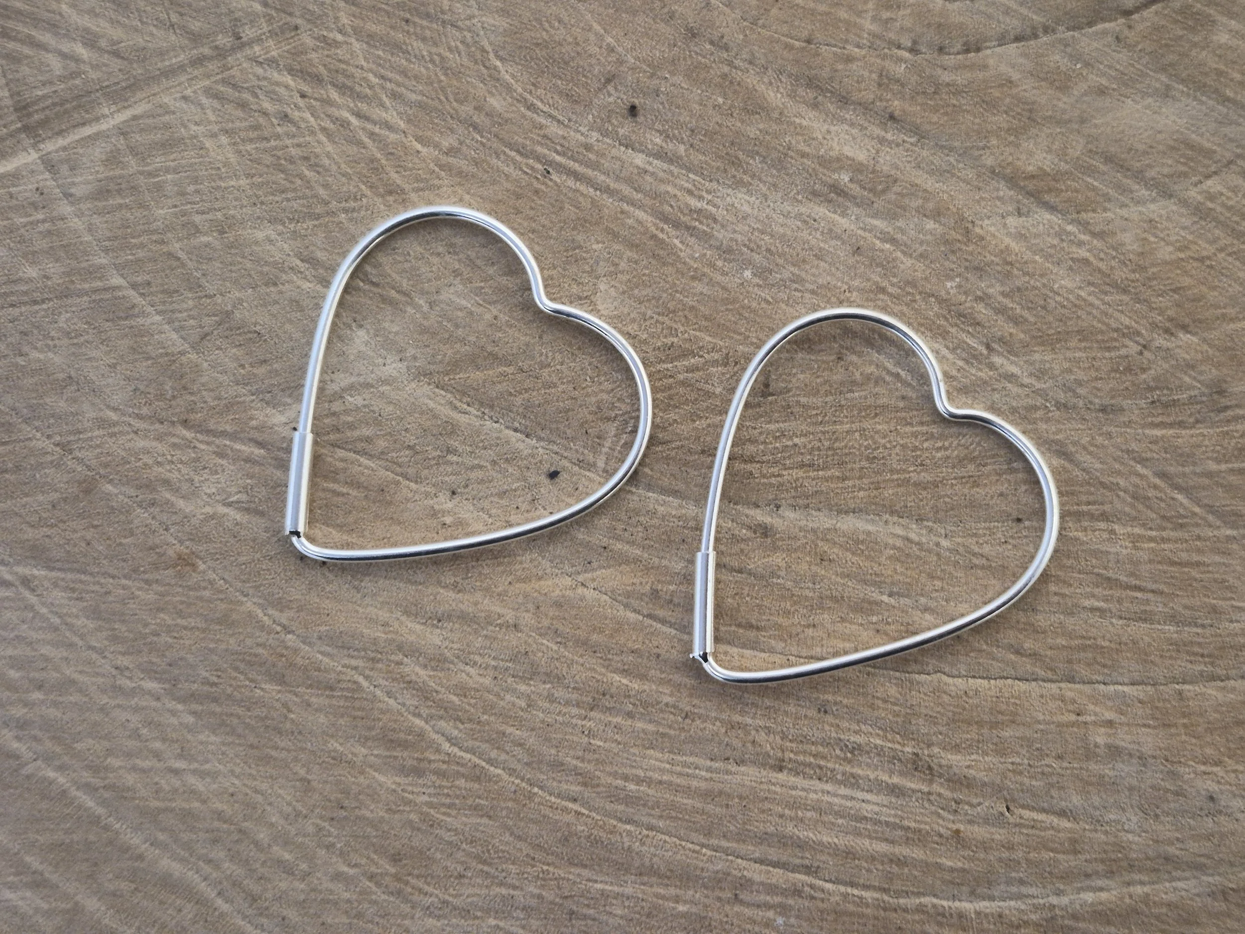 Medium size sterling silver heart hoop earrings