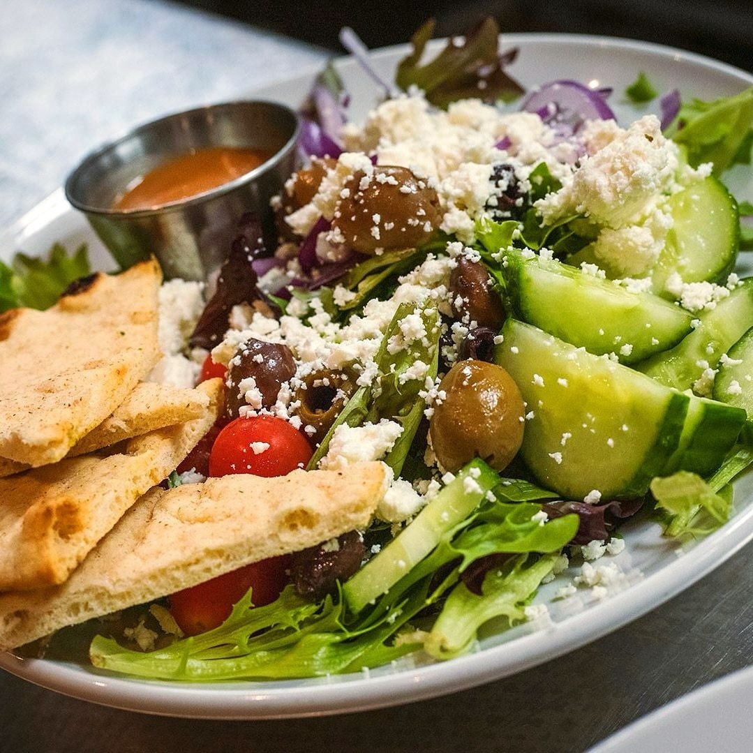 Our Mediterranean Salad is available in two sizes...small, and still not gonna share 🙃⁠
⁠
Cucumber, tomato, crisp pita, red onion, olives, feta, mixed greens, lemon-spring onion dressing⁠
⁠
We&rsquo;ll be open 11am&ndash;9pm on Sunday, stop in and g
