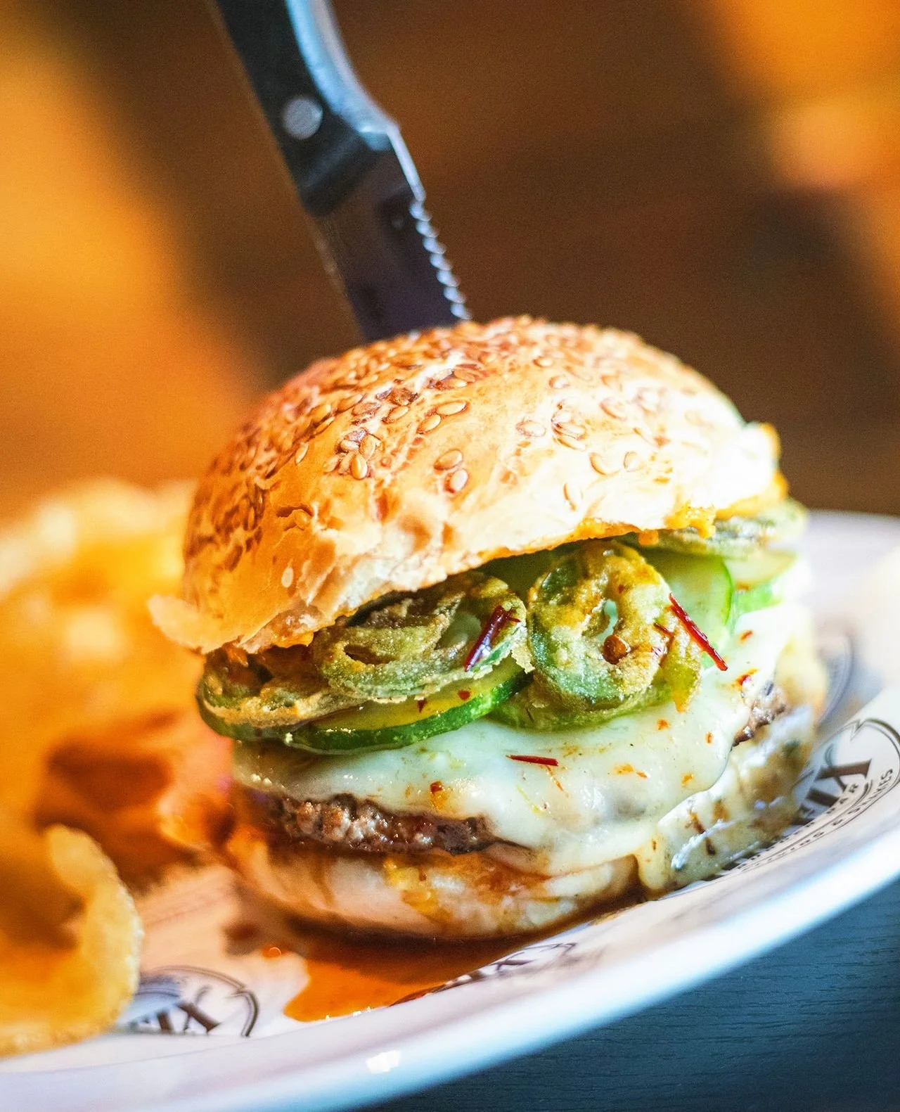 The Cajun Honey Burger 🍯 Two 4oz. cajun-spiced house patties, honey chipotle glaze, pepper jack cheese, fried jalape&ntilde;os, pickles, cajun remoulade, seeded roll⁠
⁠
Now in Worcester!