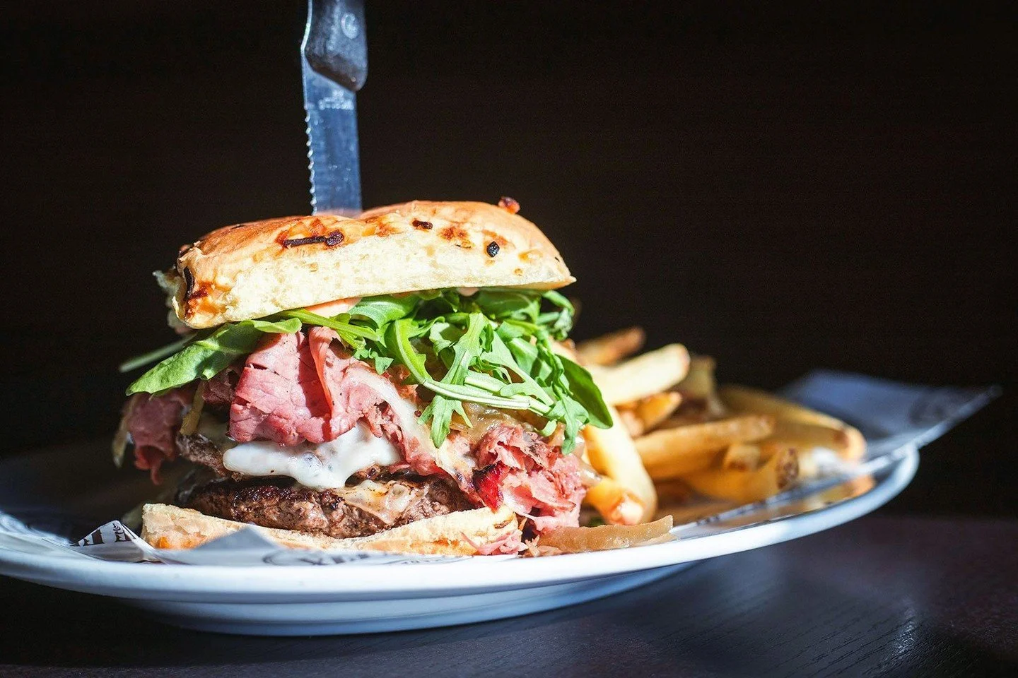 Buried beneath all that shaved pastrami are two juicy 4oz. patties just waiting for you to sink your teeth into. Try this beauty along with our other new chef specials tonight in Marlborough!⁠
⁠
👉️ A heads up for our guests, we will be closed at bot