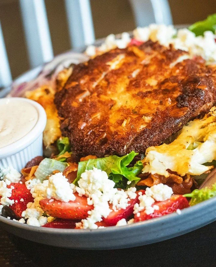 Impossible to resist. Say hello to The 'Chick Magnet'.⁠
⁠
Almond-encrusted chicken over fresh mixed greens, layered with parmesan cauliflower, strawberries, red onion, goat cheese, crispy pancetta, and finished with peppercorn ranch &ndash; Worcester