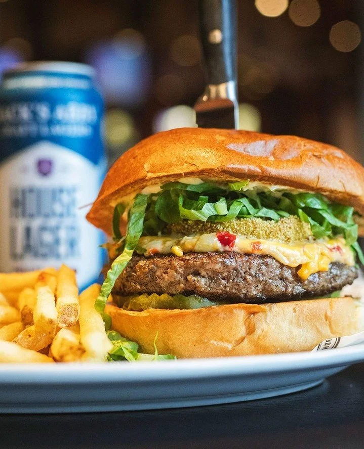 GREEN MEANS GO 🍅 A little Southern charm. A little Worcester attitude.⁠
⁠
THE MEAN GREEN stacks our 7oz. house grind patty with a fried green tomato, pimento cheese, shredded lettuce, crinkle pickles and remoulade on brioche.⁠
⁠
A new Chef Special, 