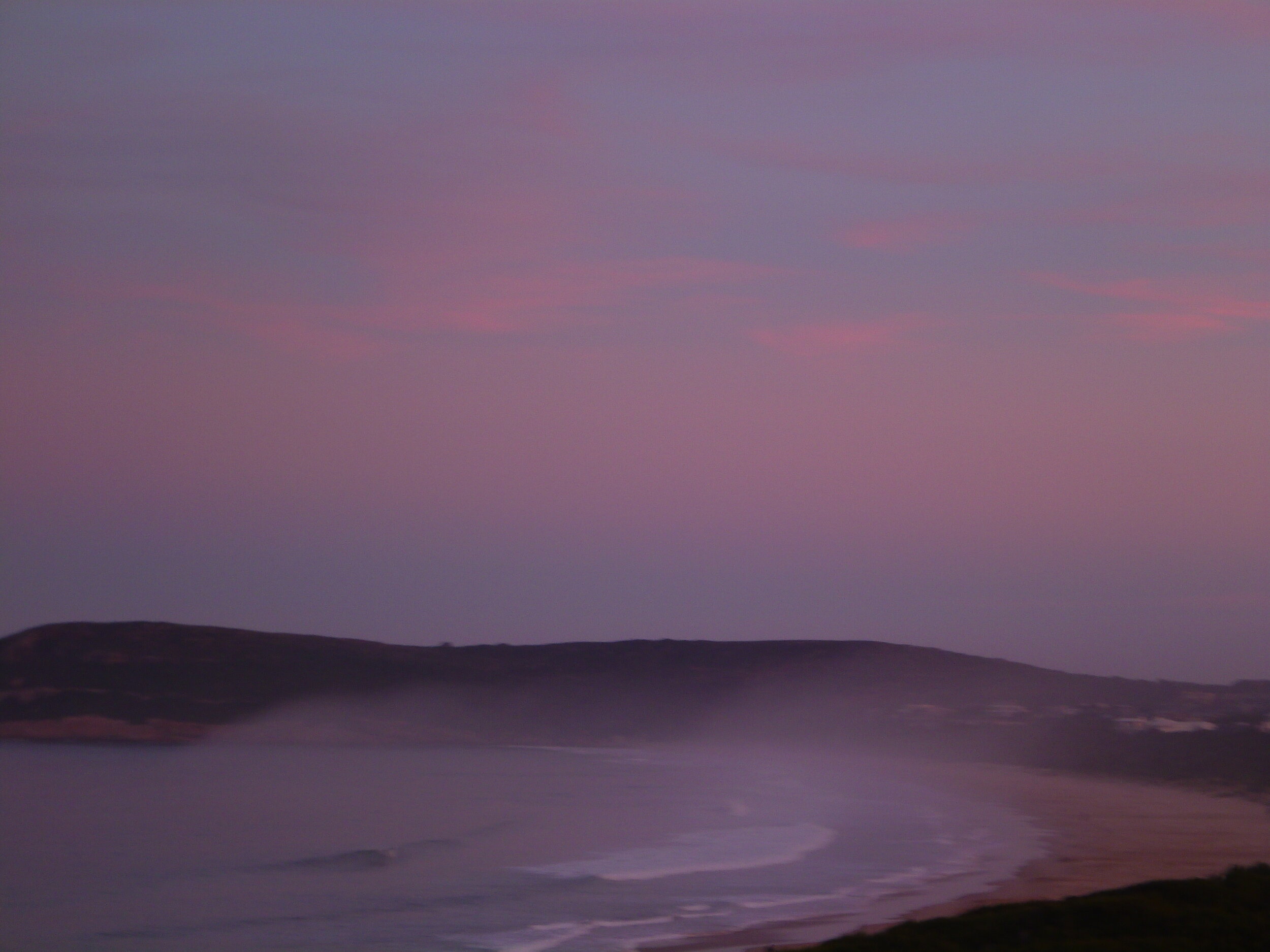 Mystical sunset and natural light show over Robberg Beach, Plettenberg Bay, South Africa