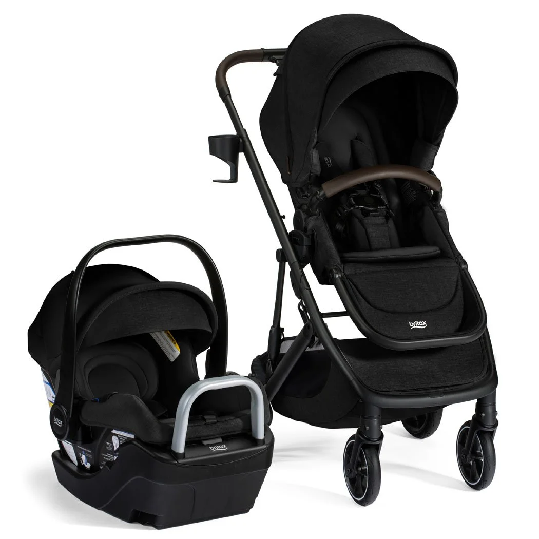 A black stroller and infant car seat on a car seat base.