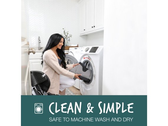 Woman placing green contour car seat cover into washer (Copy)