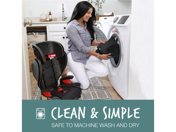 Woman placing car seat cover into her washing machine
