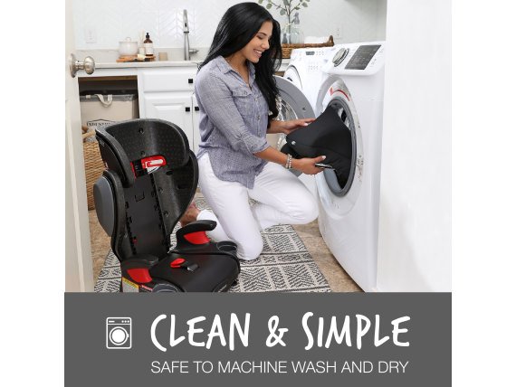 Woman placing car seat cover into her washing machine