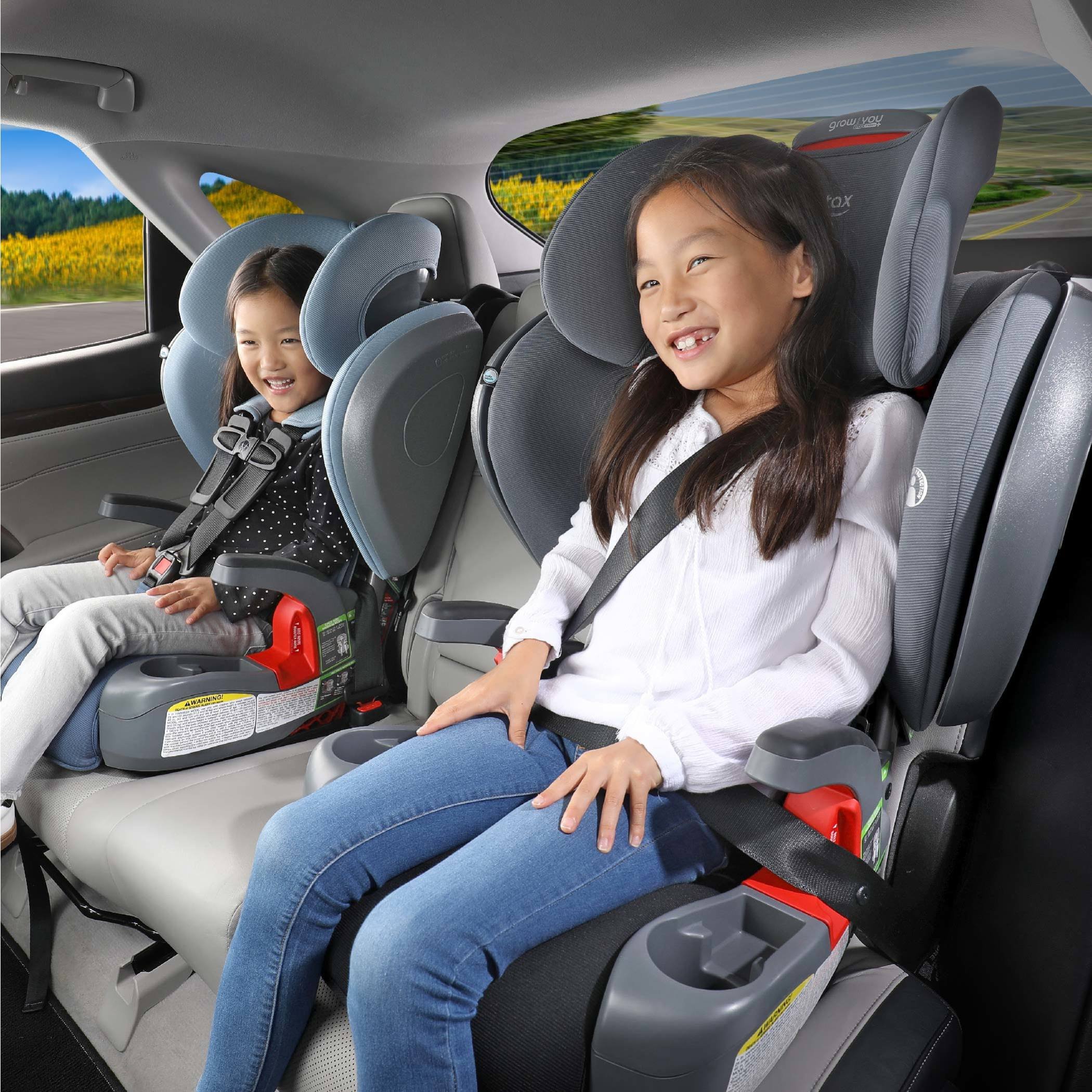 Children riding in car seat, one in booster mode and one in harness mode