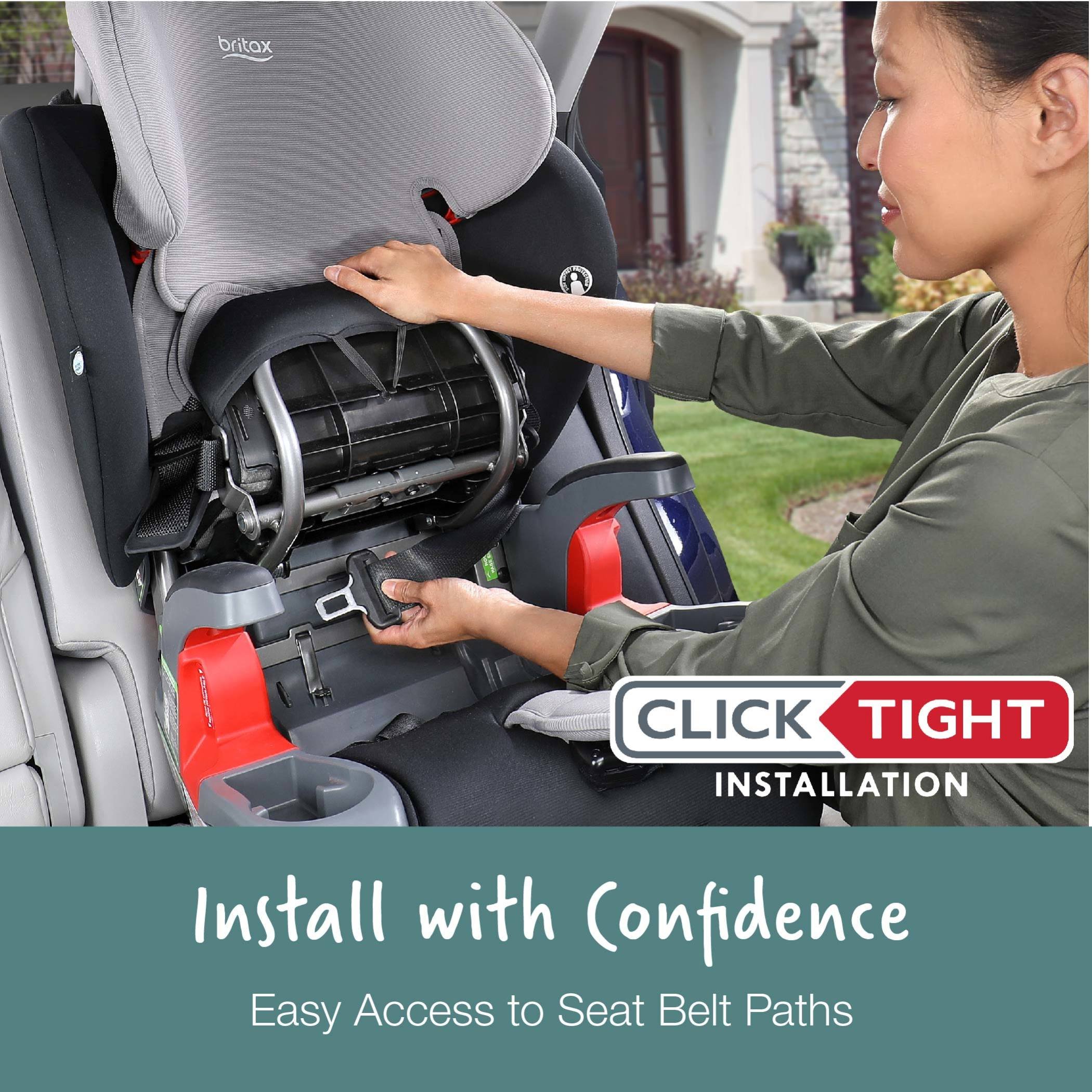 Mother installing car seat using clicktight installation