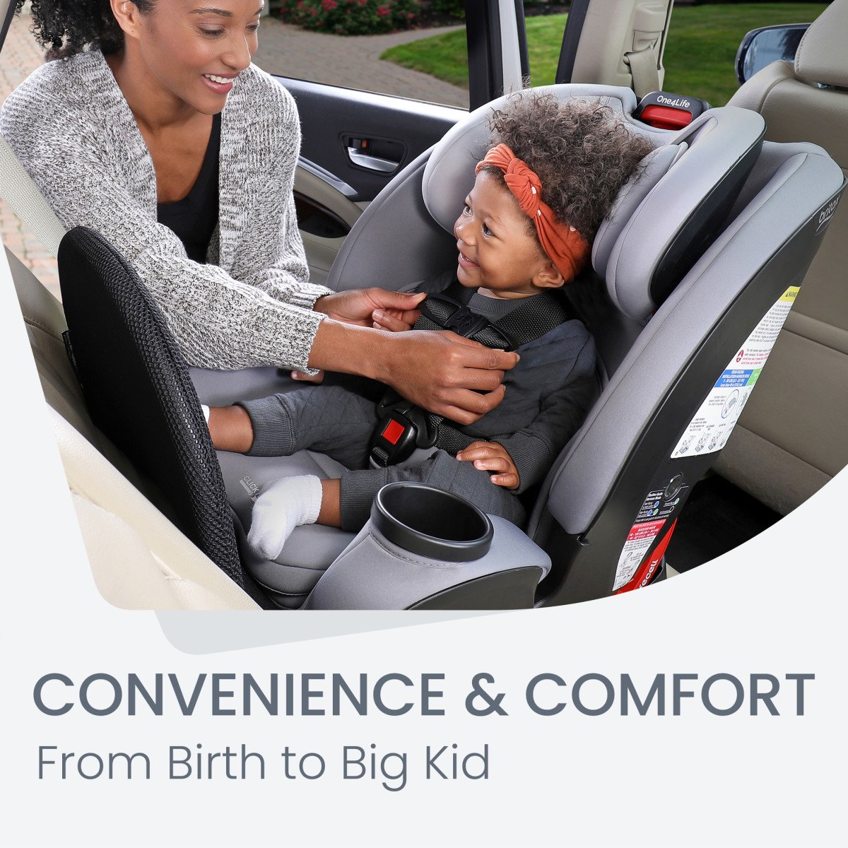 Mom adjusting the One4Life Car seat to her child