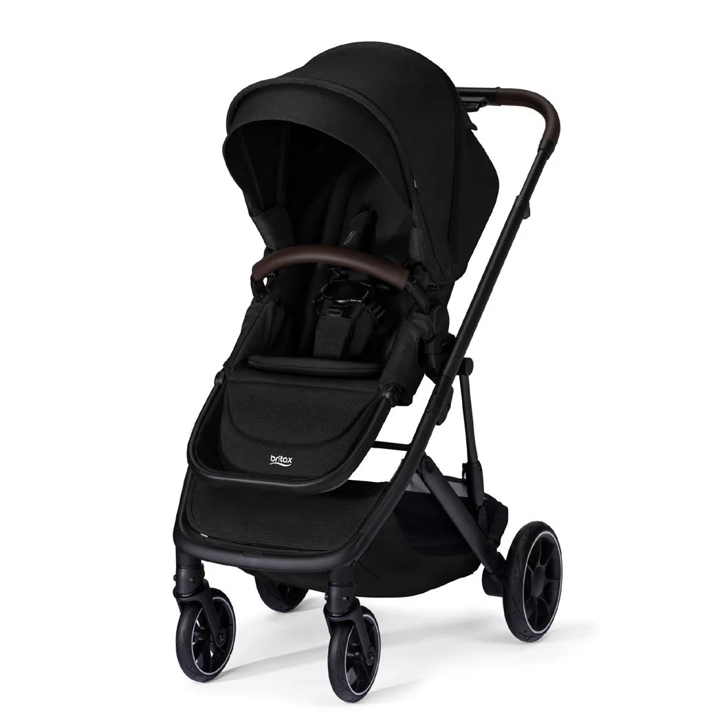 A black stroller with a canopy, a brown bumper bar, and the Britax logo on the leg rest. 