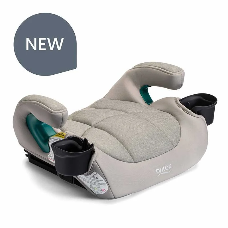 A backless booster car seat with a tan cover, armrests, contour lines on the cover, and two cup holders.