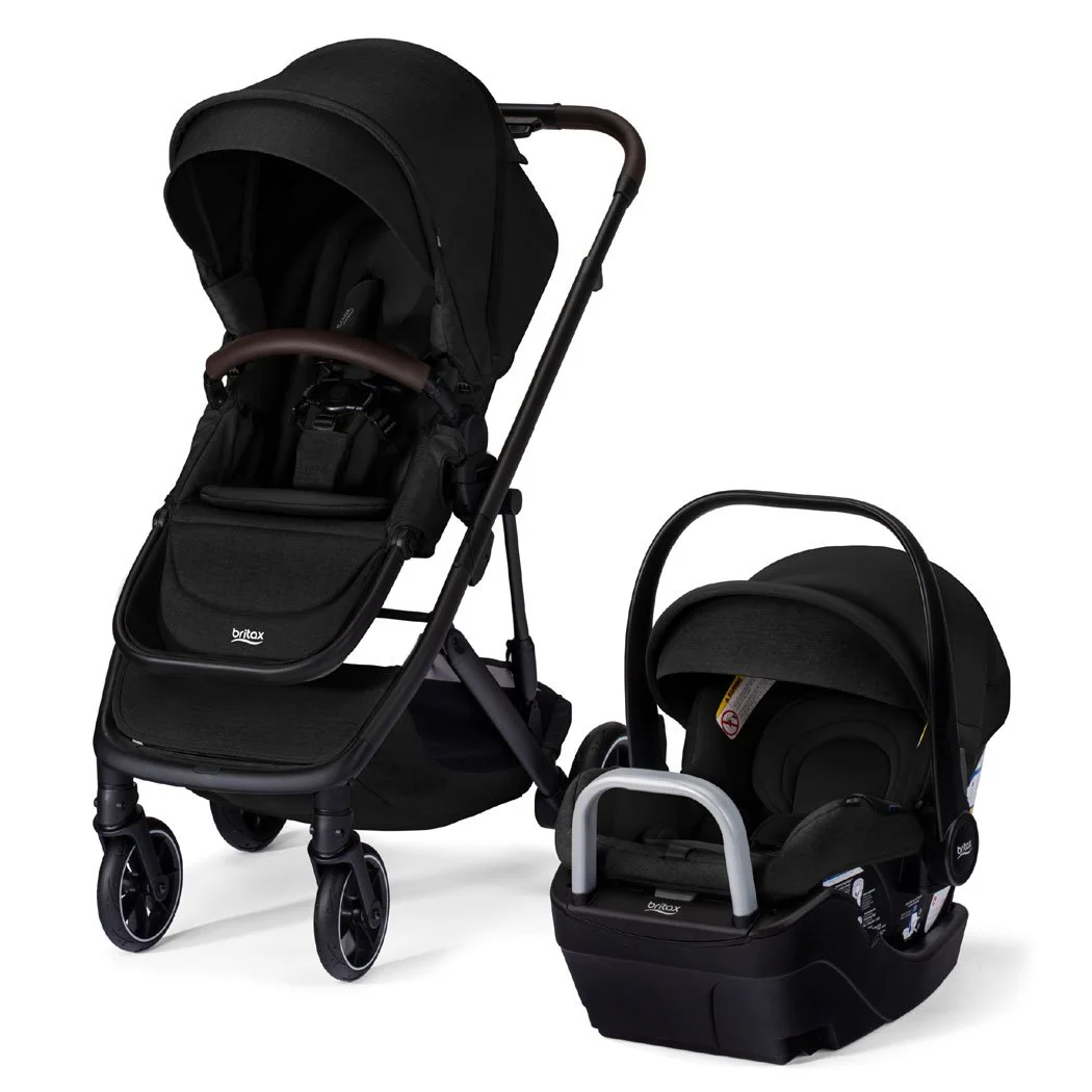 A black stroller and infant car seat on a car seat base. The stroller has a canopy and a bumper bar. 