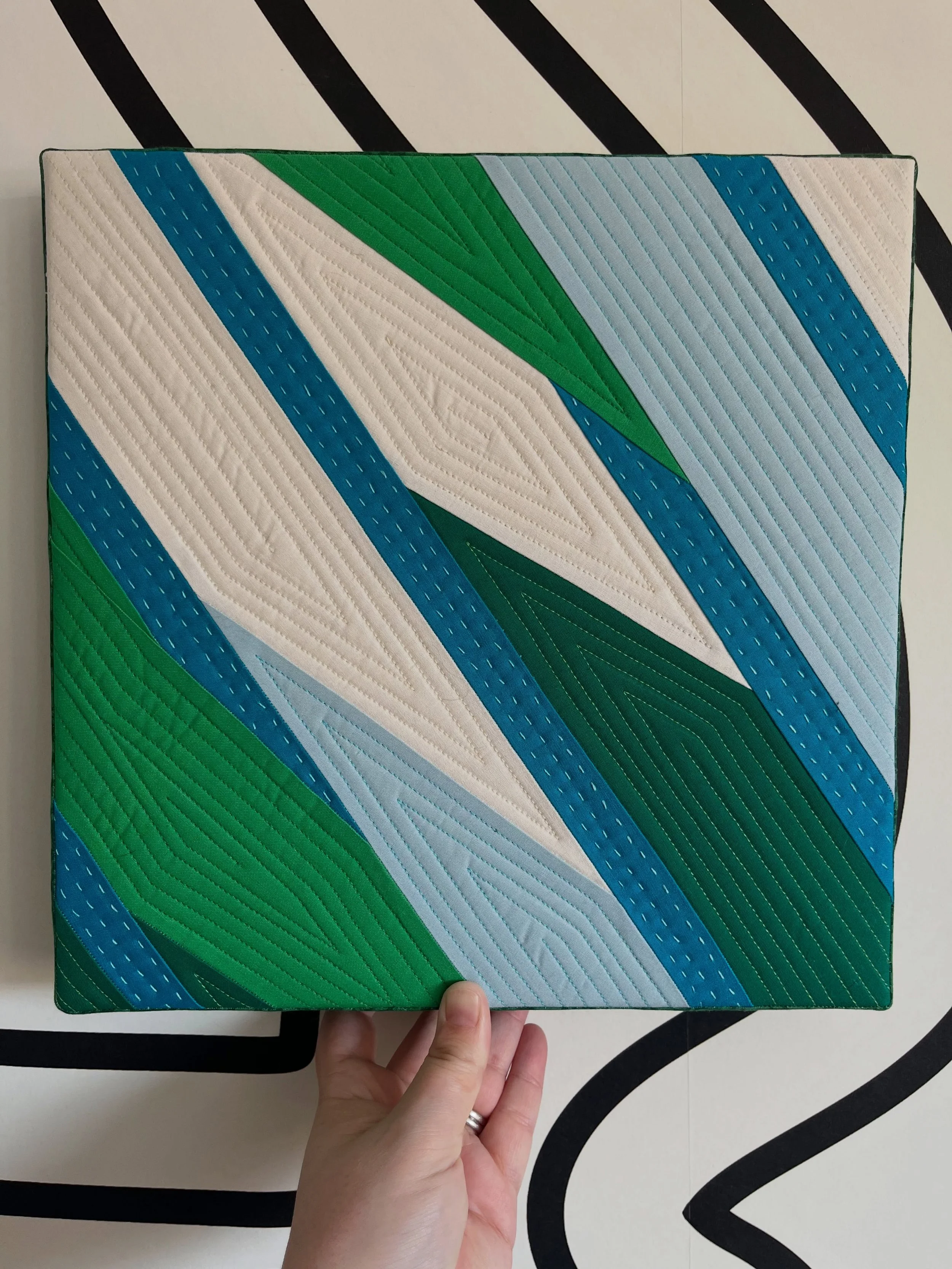 I had the pleasure of tech editing @juliawachs.designs newest pattern, Alderbrook, and I couldn&rsquo;t resist whipping up a block for myself and canvas mounting it. I love the movement in this design so I echoed that in my machine quilting and then 