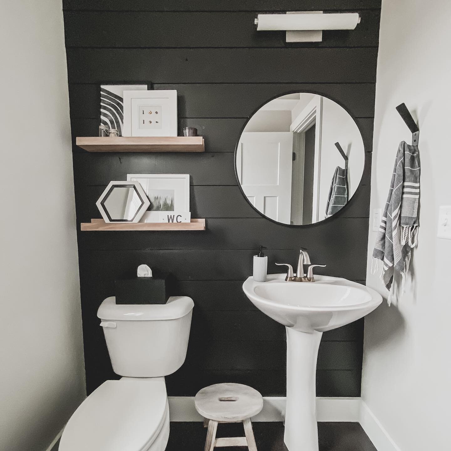 Powder room makeover phase 1 is done! The space wasn't bad before but I love that it has so much character now.⁠⁣
⁠⁣
To minimize costs on this project I mixed paint I had on hand, built my own shelves, and spray-painted a mirror I found at @homegoods