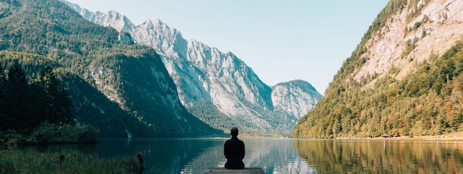 COPLE-mountain-lake-person-sitting-back-min.jpg