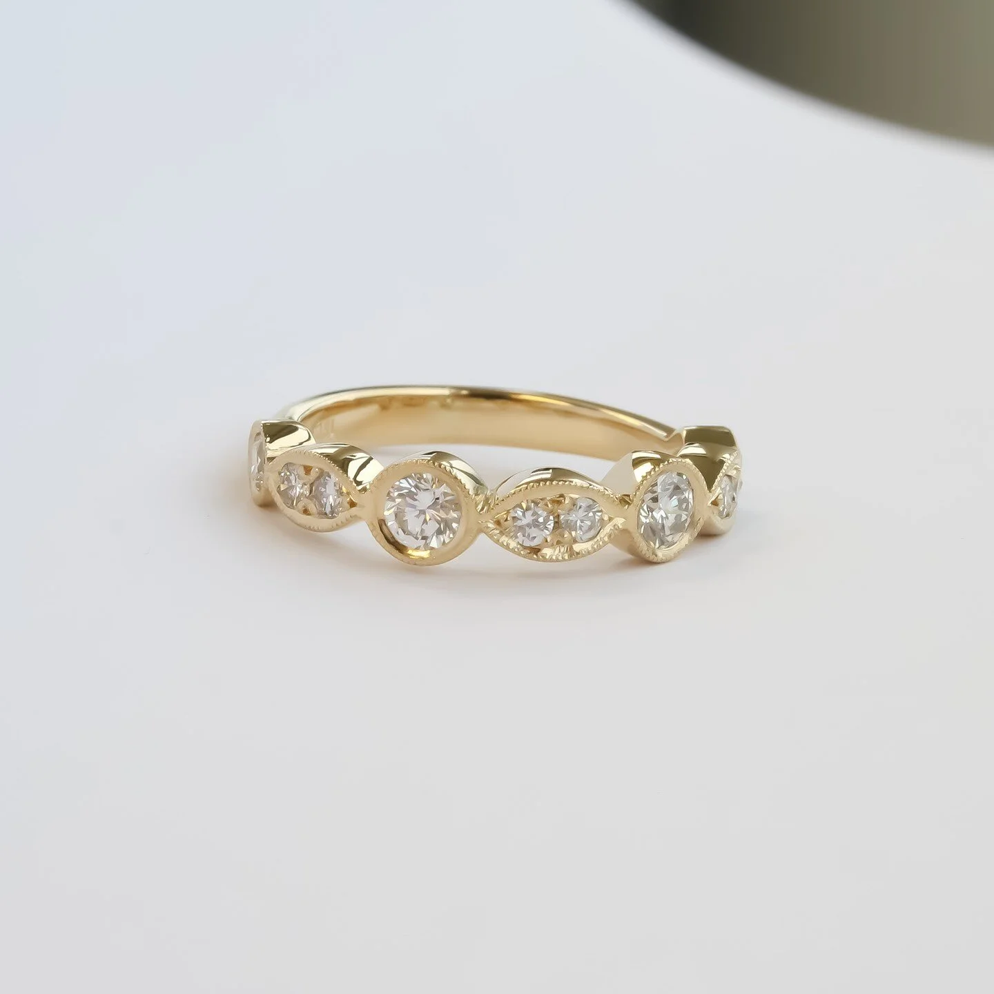 Handmade yellow gold wedding ring with antique milgrain sides.