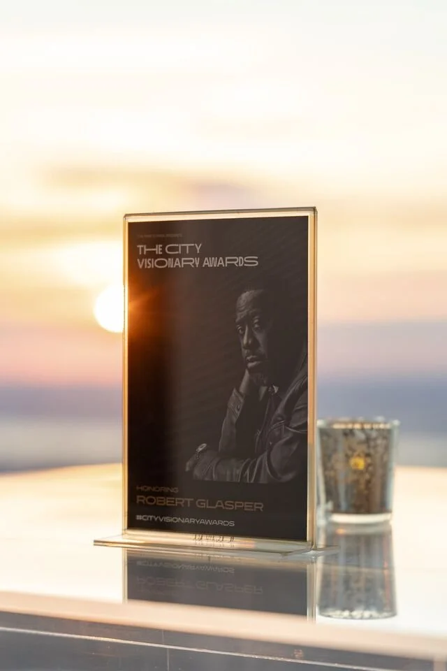 Card highlighting the honoree, Robert Glasper. Photo credit: Auden Barbour