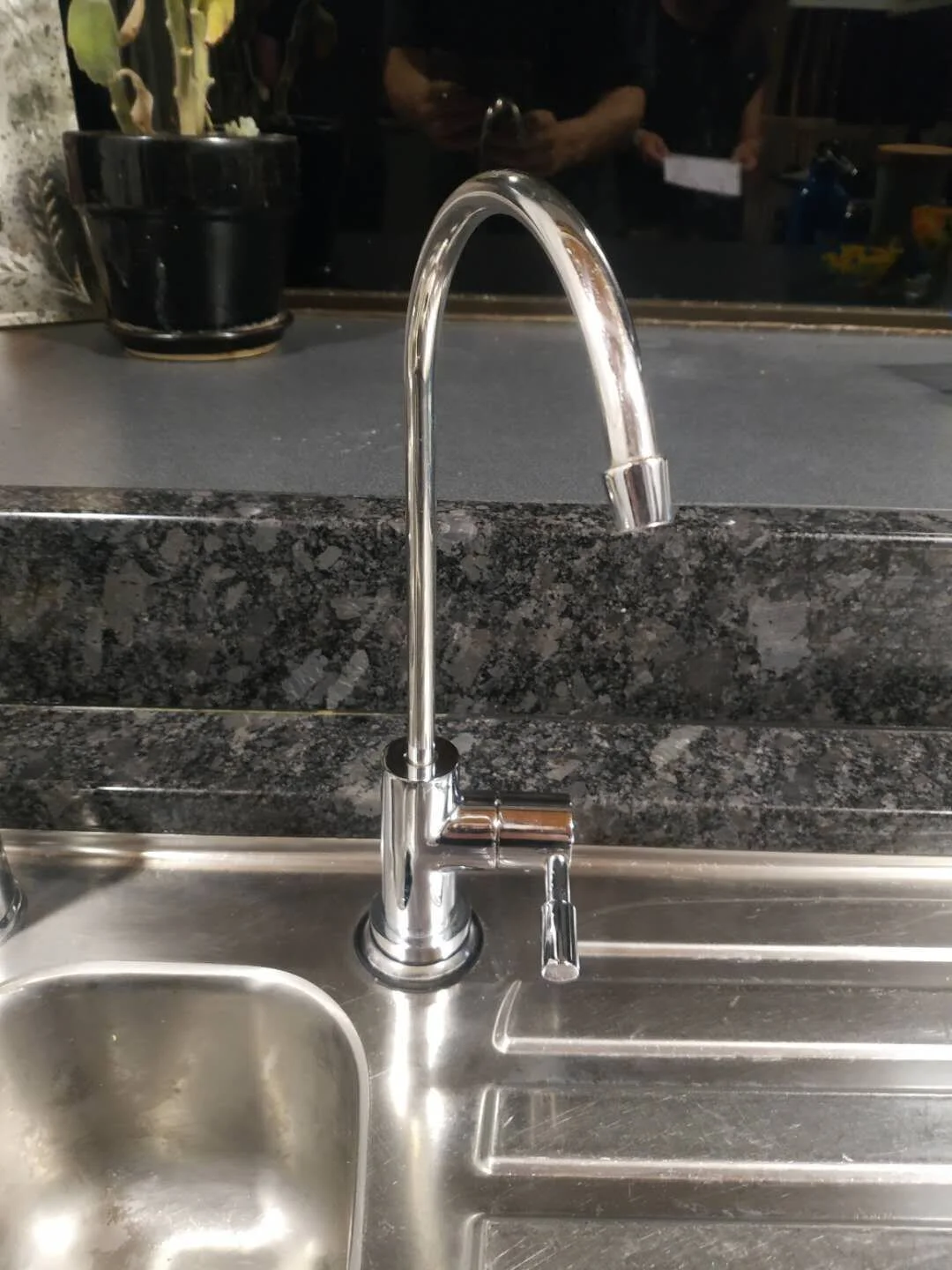 Polished Stainless Steel faucet fitted to stainless steel bench top