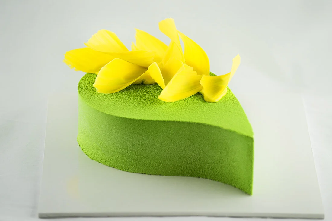 Matcha, mango and passion fruit mousse cake
