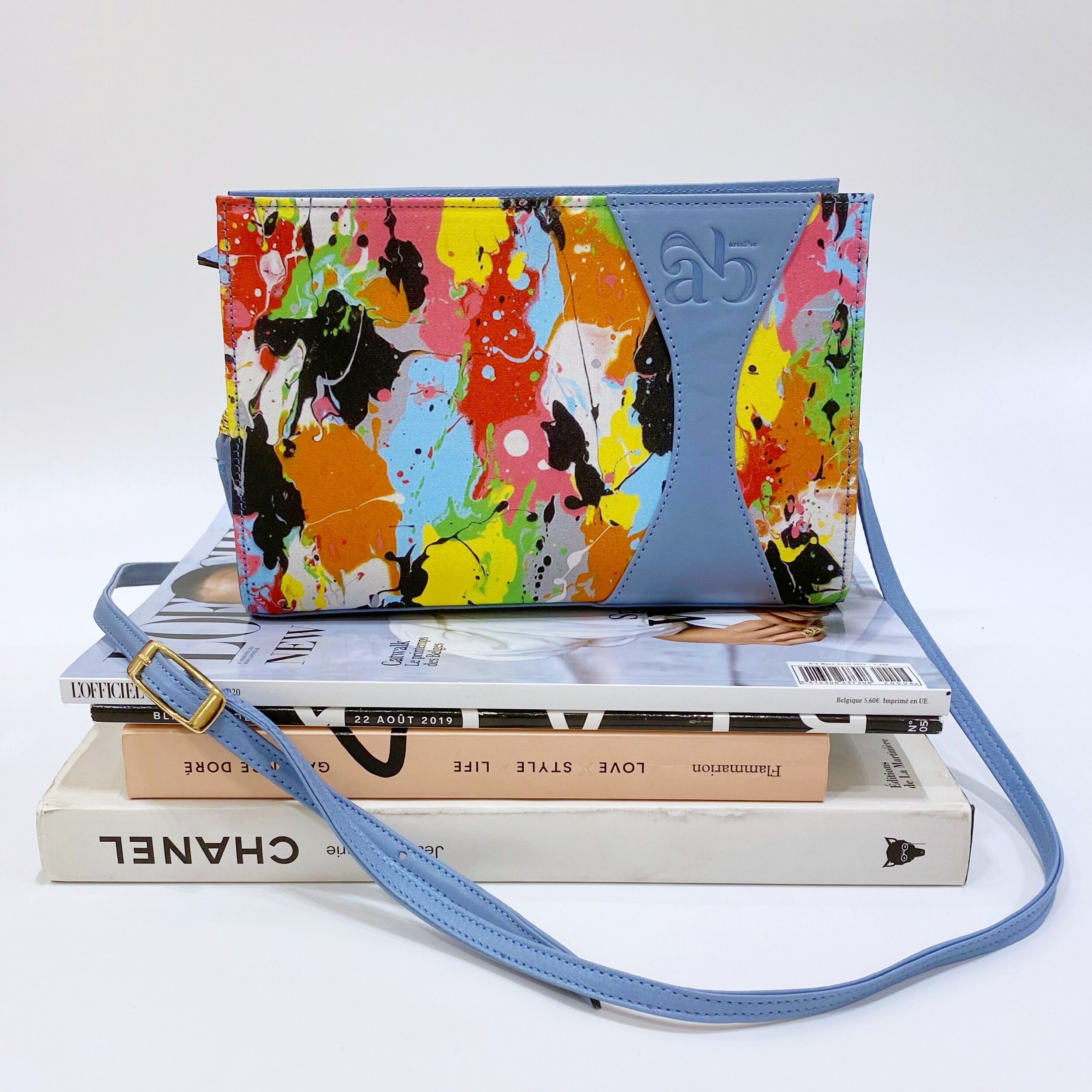 Clutch Bag Zoé in sky blue leather global view, artwork Pelletane