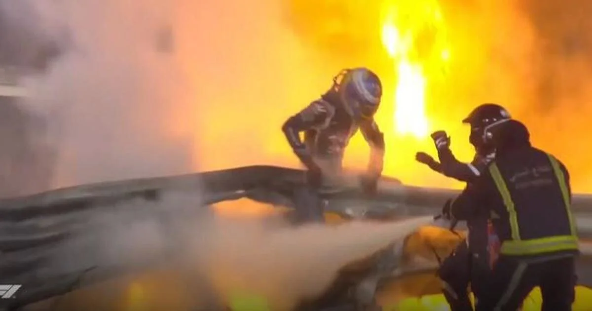 Romain Grosjean jumping out of his car. (photo credits - Scroll In Media)