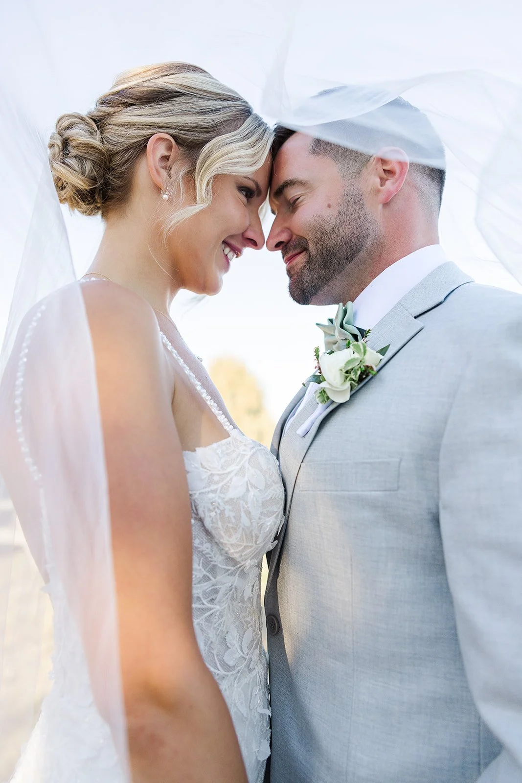 Just married couple walking in field in Livingston County