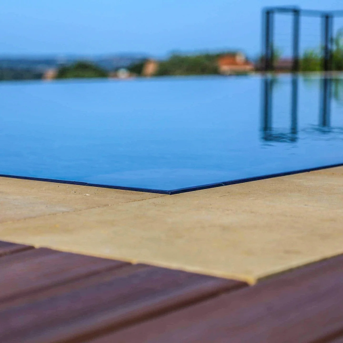 A seamless horizon. This Lautner-edge pool uses a hidden perimeter slot to let water sit perfectly flush with the deck&mdash;no coping, no splash line, just a sheet of glass.

Named after architect John Lautner, whose work emphasized fluid indoor&nda