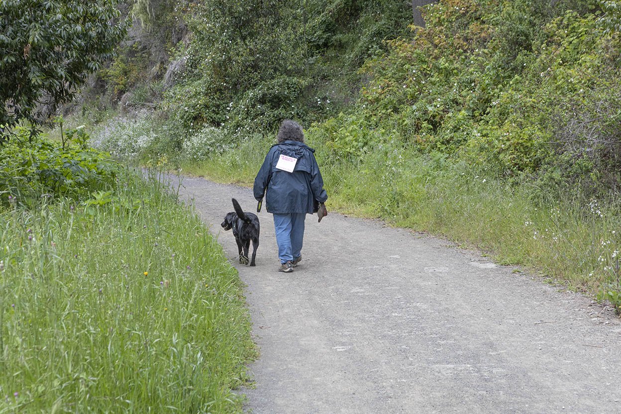 Woman and her dog walk the trail for Walk and Paddle for Cancer (Copy)