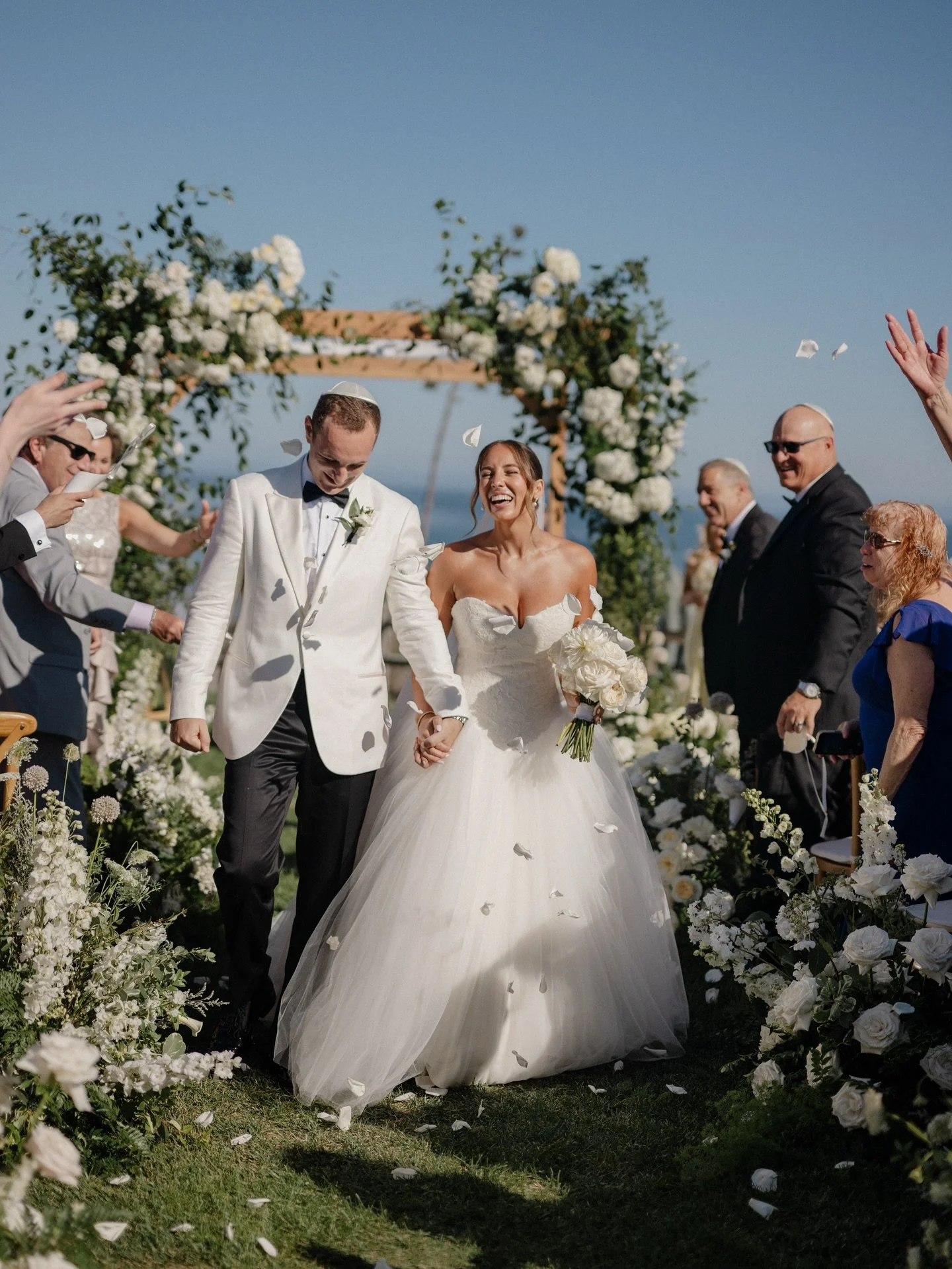 Magic on the iconic bluff at @ritzcarltonbacarasb for Jamie &amp; Adam 7.27.25 🌼

Planning: @luckeleven_events 
Venue: @ritzcarltonbacarasb 
Photography: @brocoffphotography 
HMU: @marla_hairandmakeup 
Arch: @bellavistadesigns 
Couple: @jaammiie &am