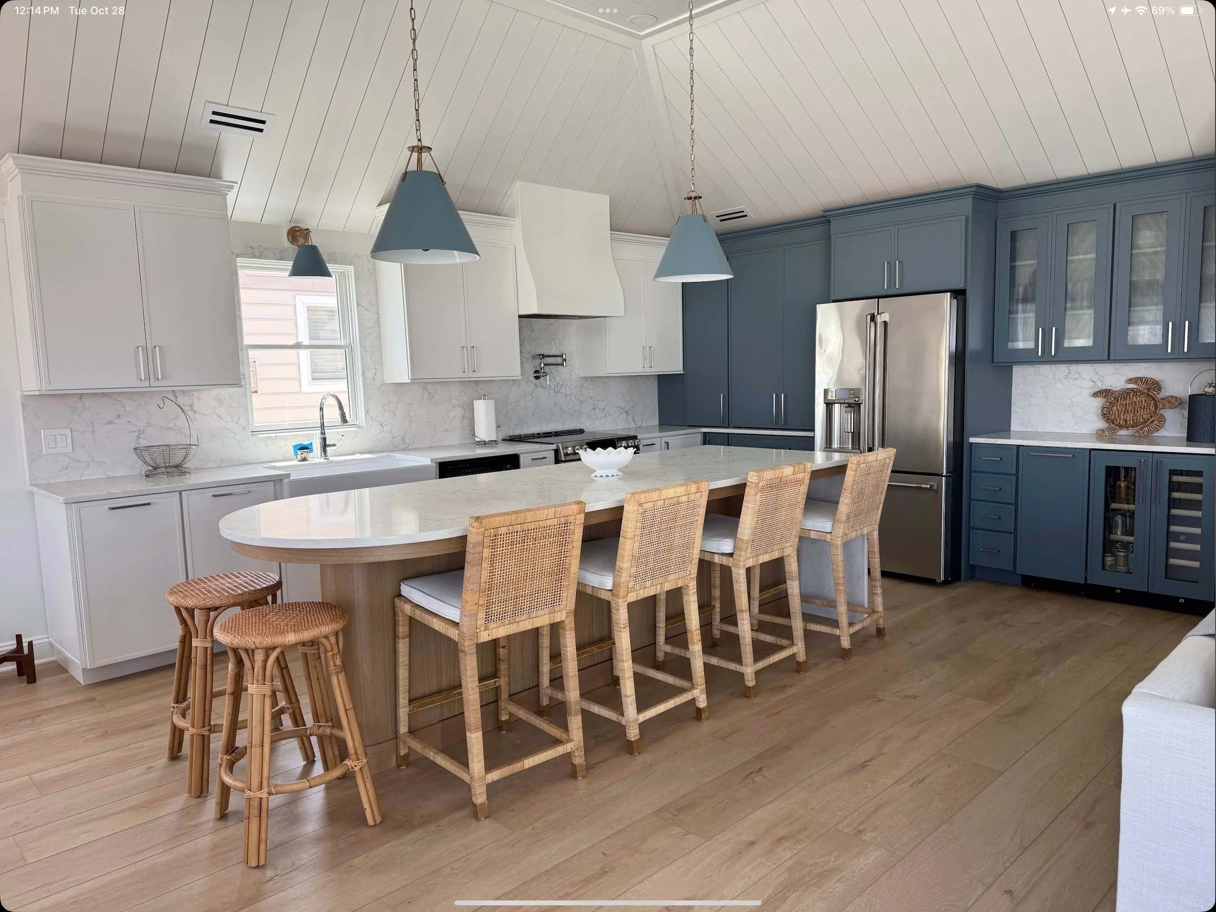 Modern Ocean City kitchen renovation featuring blue cabinets and stainless-steel appliances by 2B Contracting.