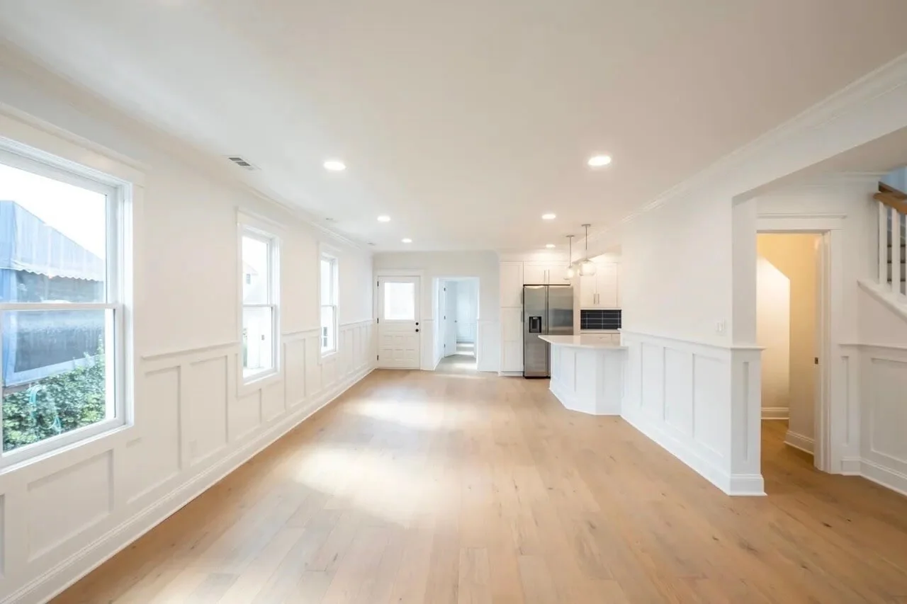 Full exterior renovation in Ocean City featuring blue siding, white trim, and covered front porch by 2B Contracting.