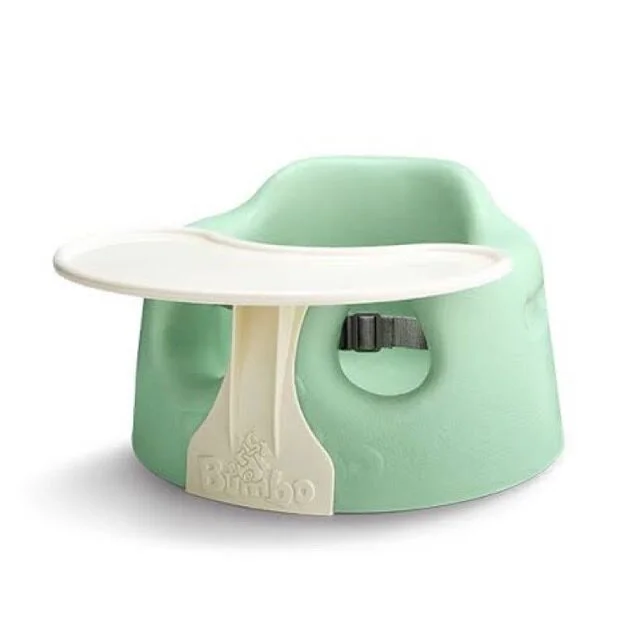 green bumbo with tray