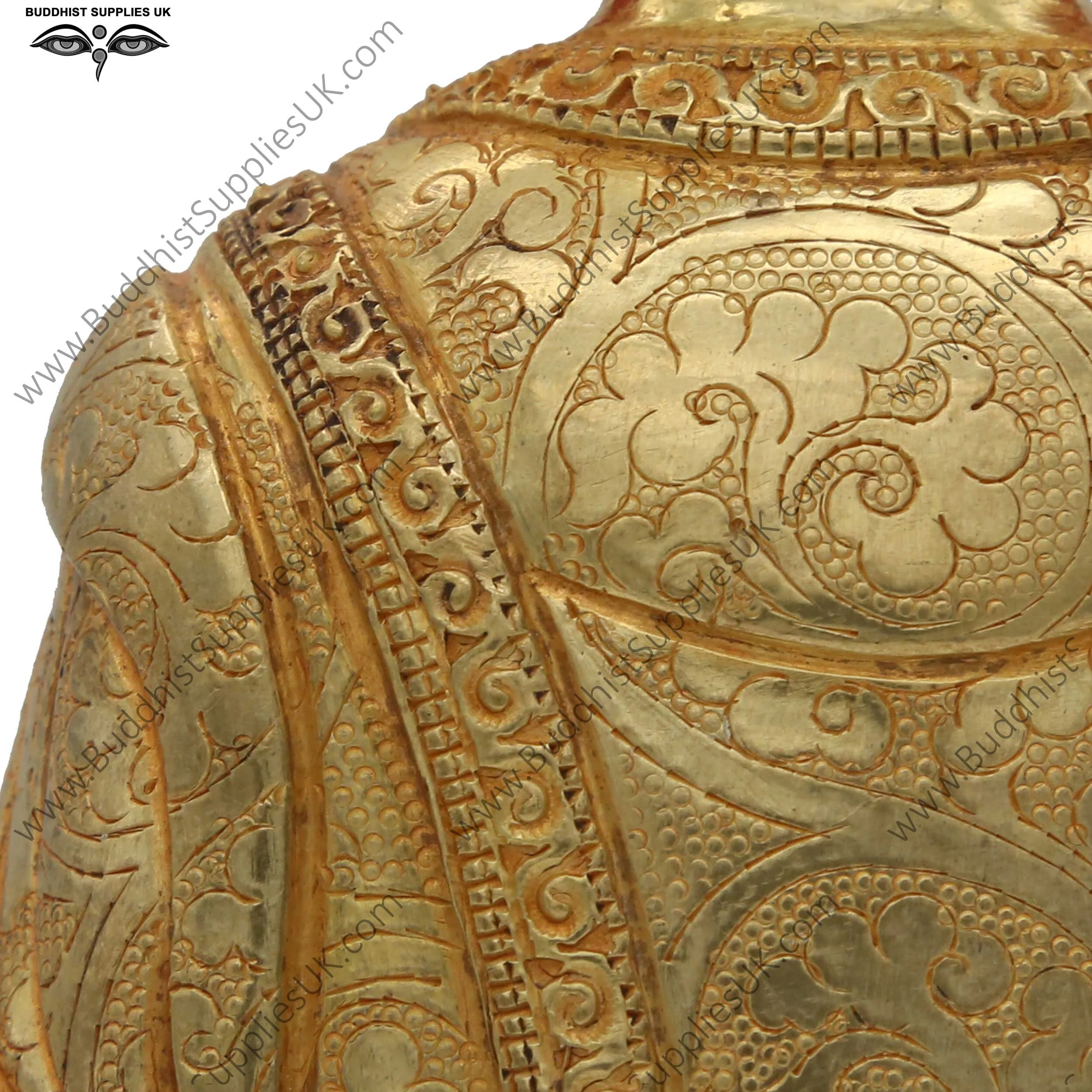 Gold plated Shakyamuni Buddha statue carving detail
