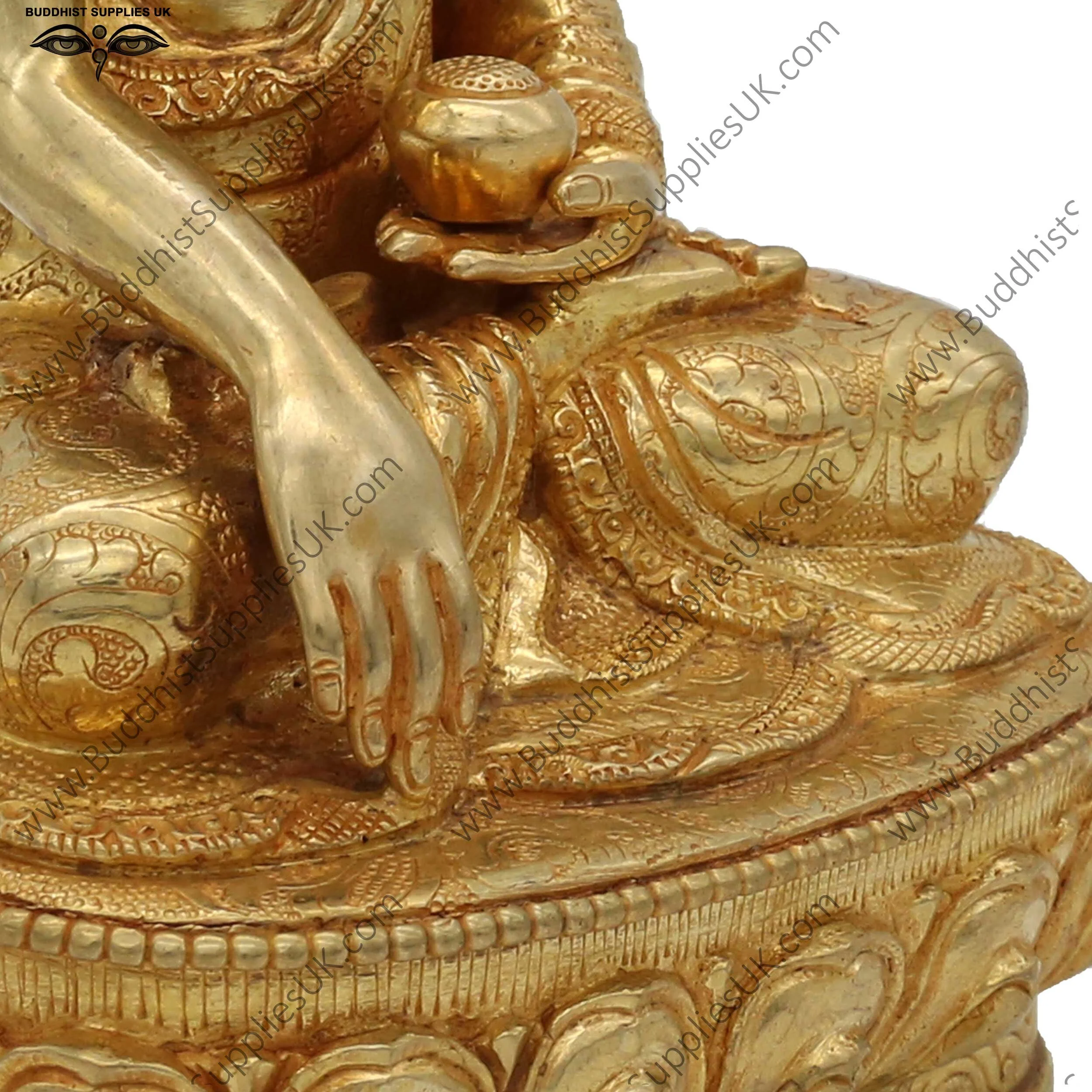 Gold plated Shakyamuni Buddha statue carving detail
