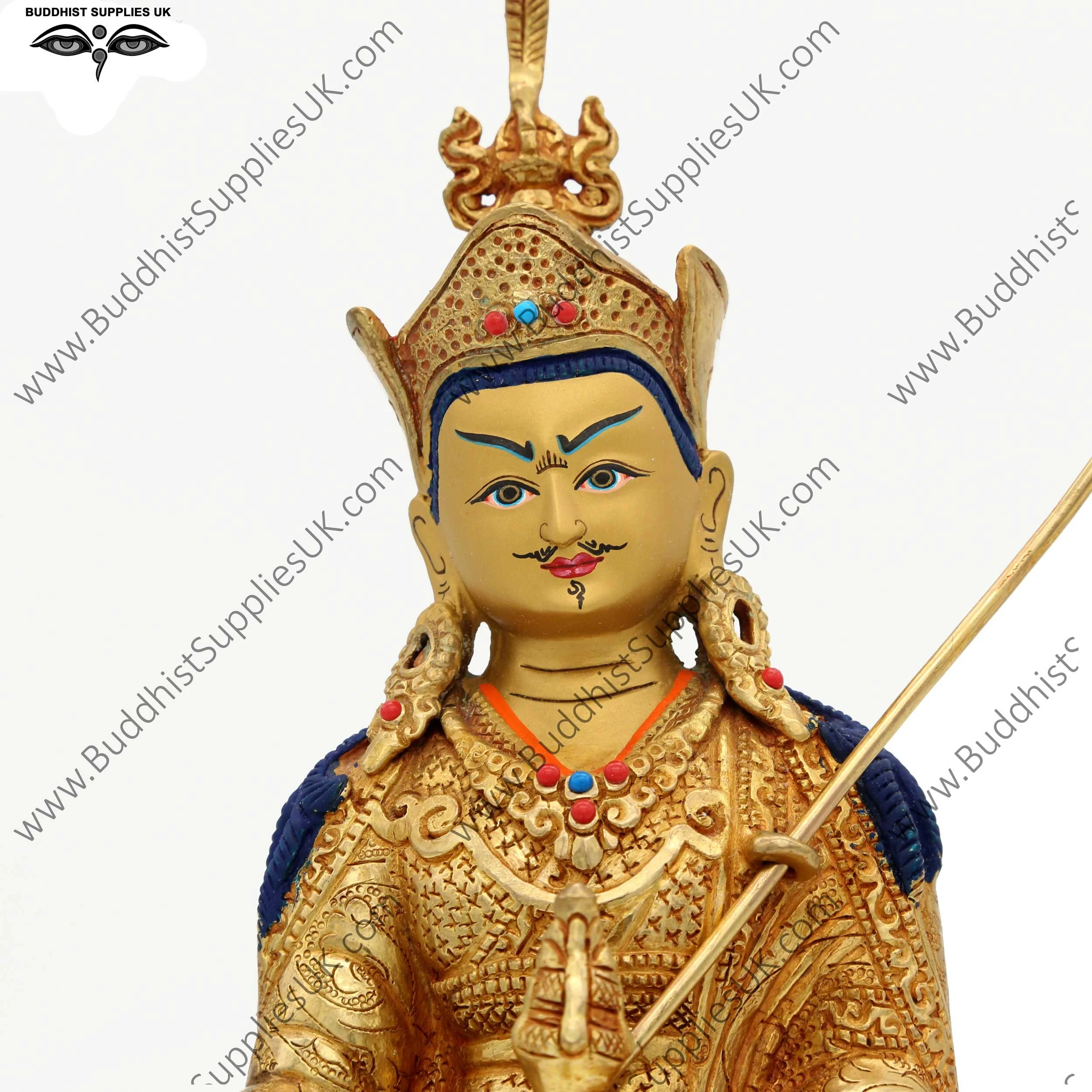 Gold plated Guru Rinpoche statue face