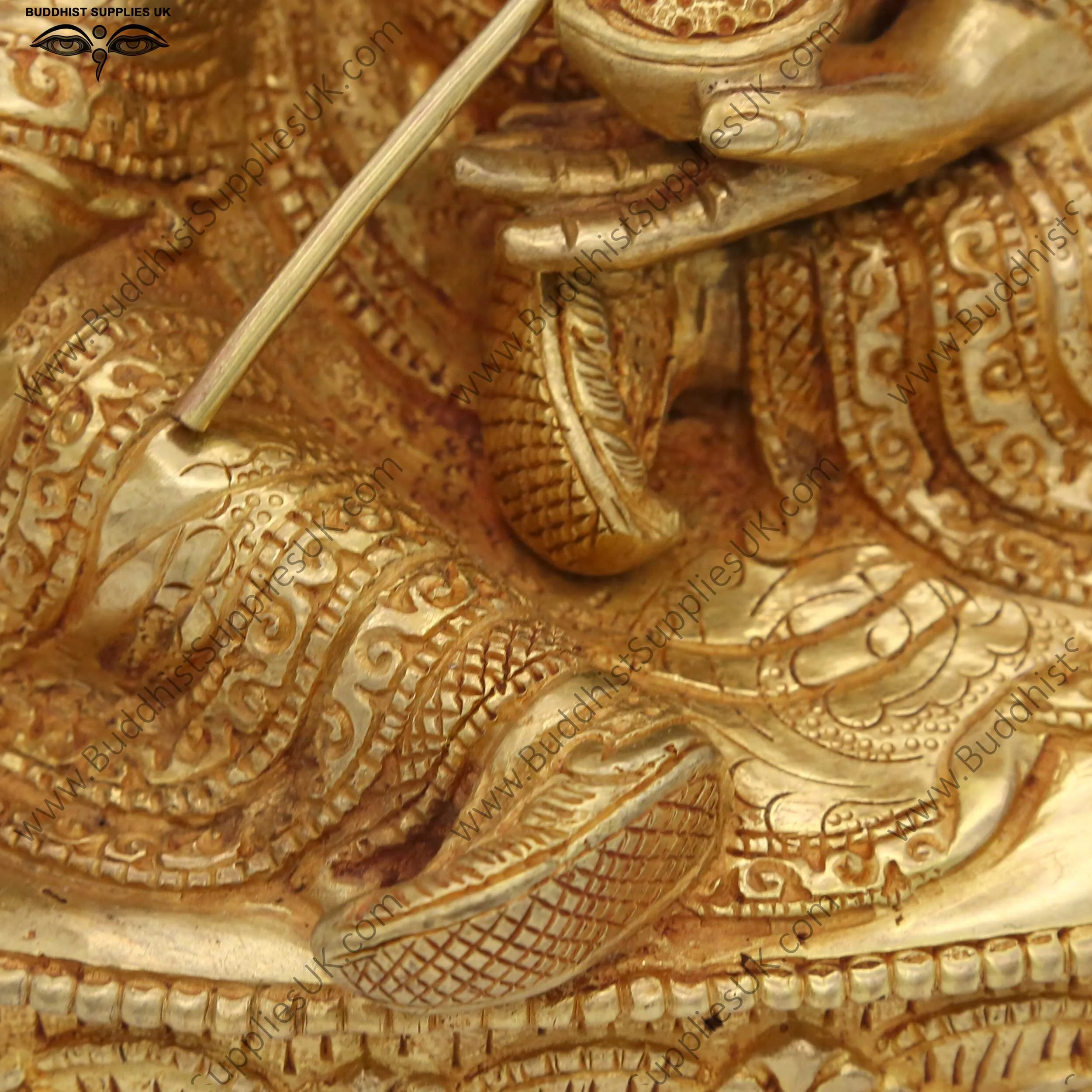 Gold plated Guru Rinpoche statue carving detail