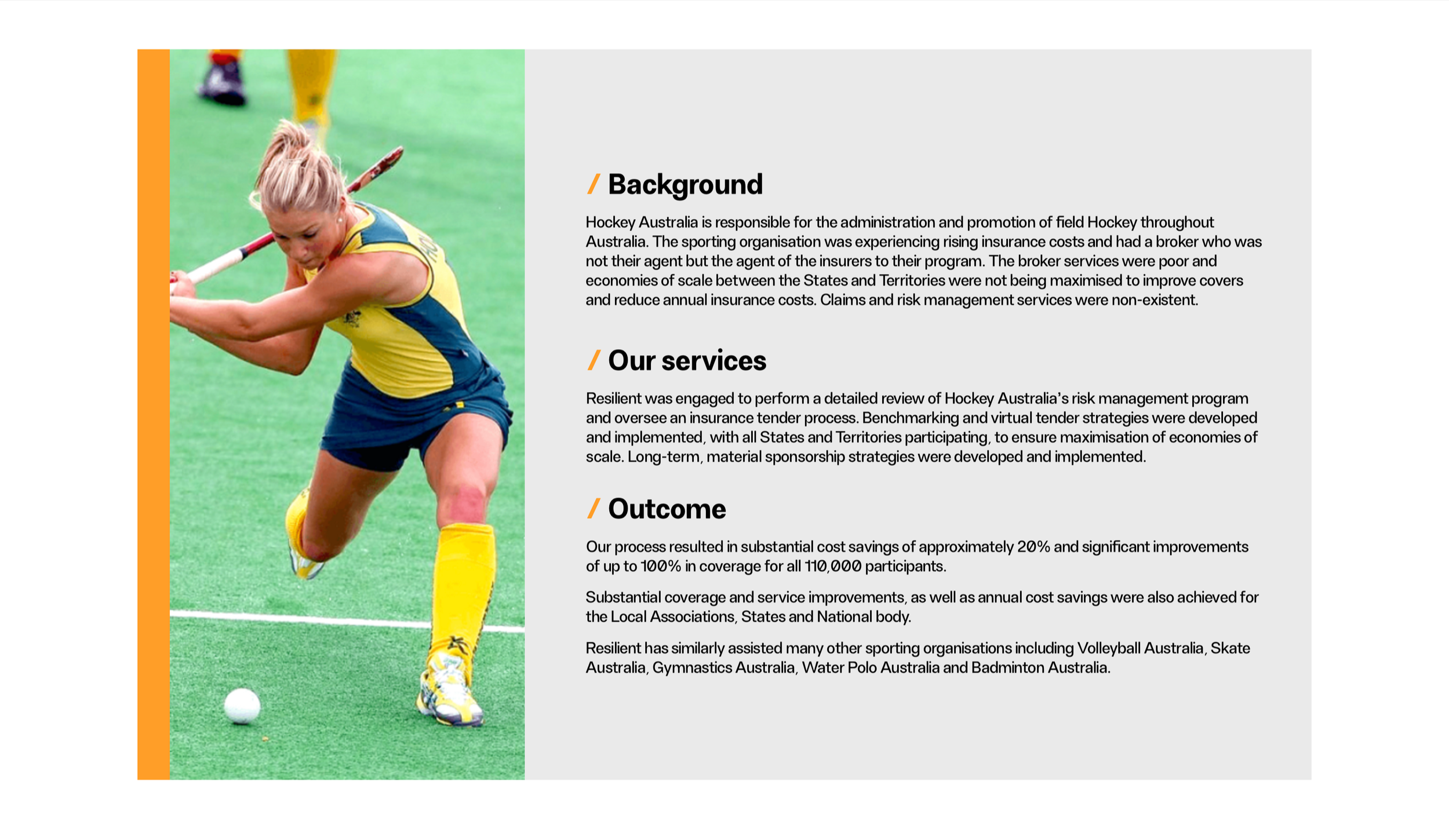 Australian female field hockey player in yellow and blue uniform, bending forward and preparing to hit a white hockey ball on a green field.