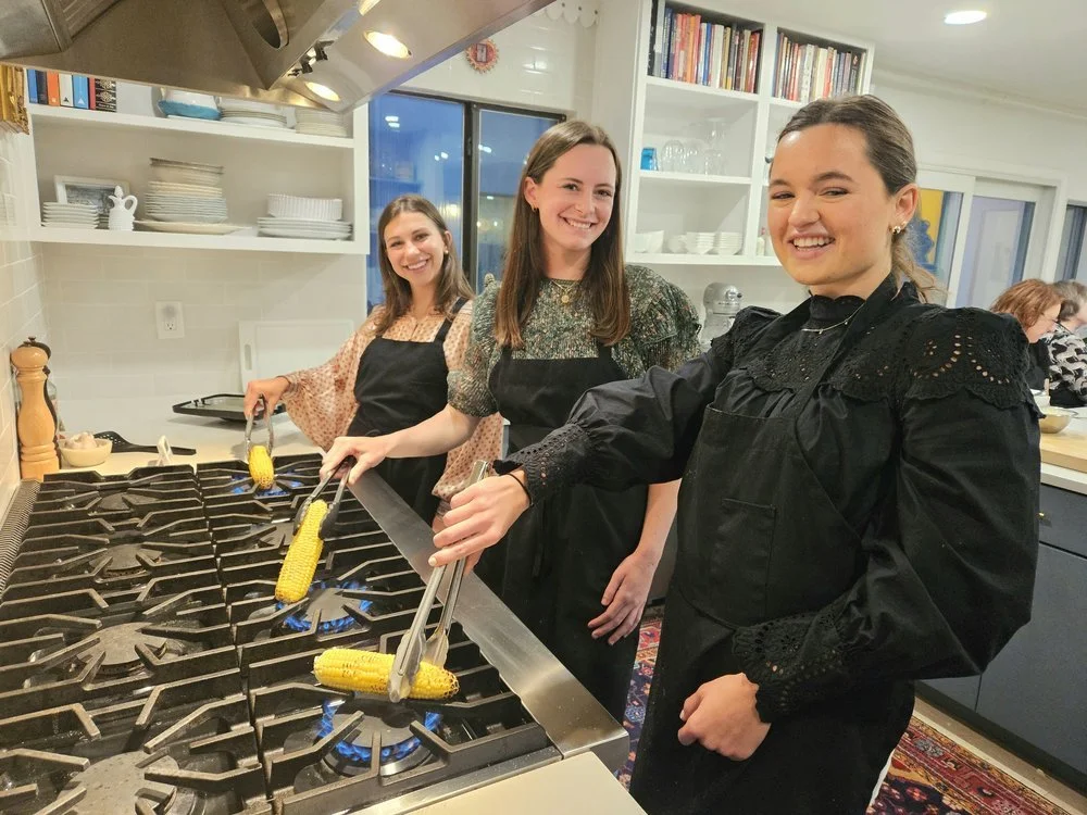 girls cooking corn.jpg