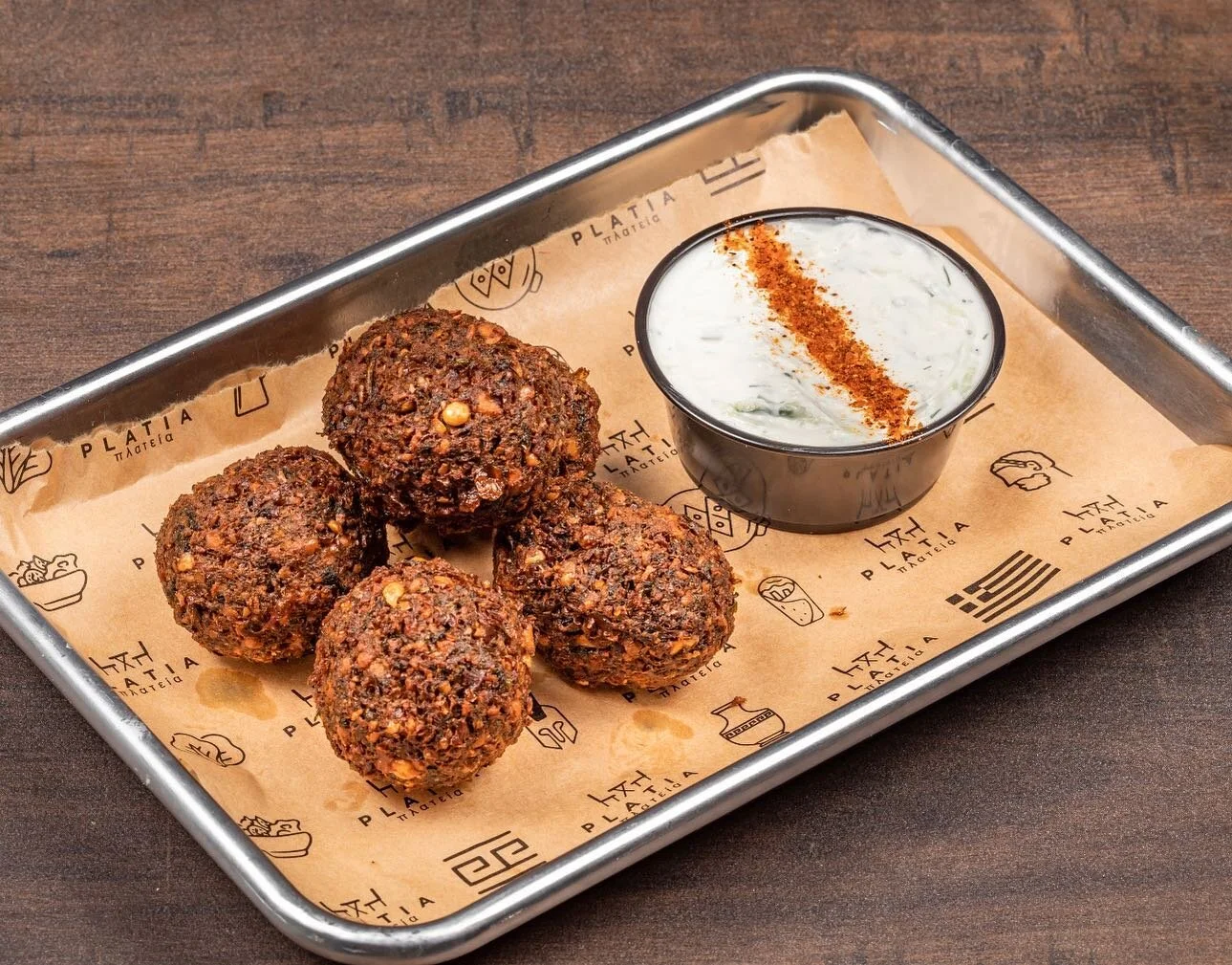 🌟 Craving a burst of Mediterranean flavor? Look no further than Platia Greek Goodness! Our Falafel is a true delight that will transport your taste buds to culinary paradise. 🥙🌿✨ With its crispy exterior and tender, herb-infused interior, it's the