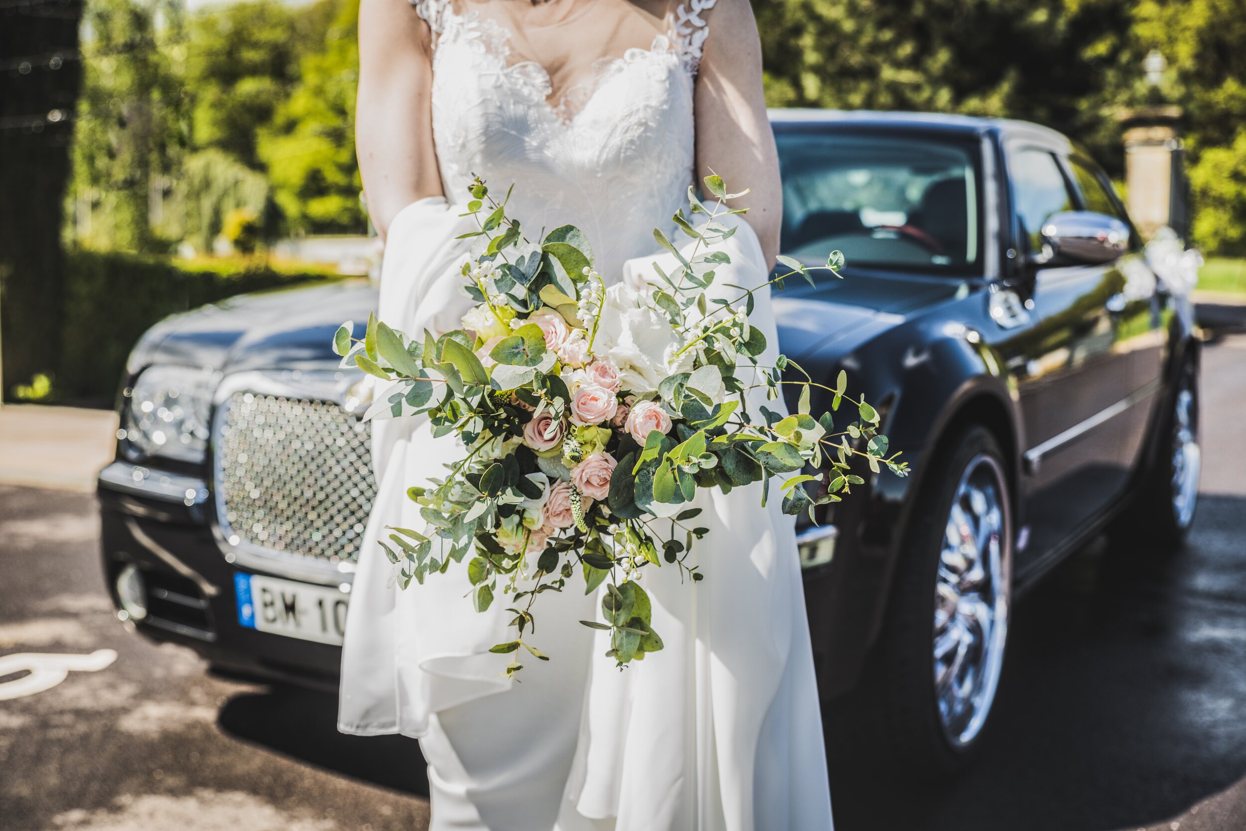 woman-in-white-wedding-dress-carrying-bouquet-in-front-of-2318049.jpg