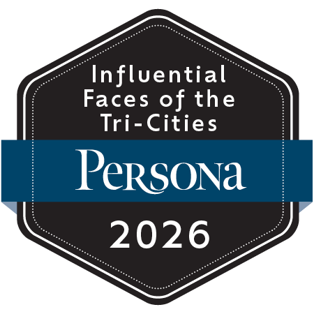 A black hexagonal badge with a blue ribbon across the center that reads 'Persona'. Text on the badge says 'Influential Faces of the Tri-Cities 2026