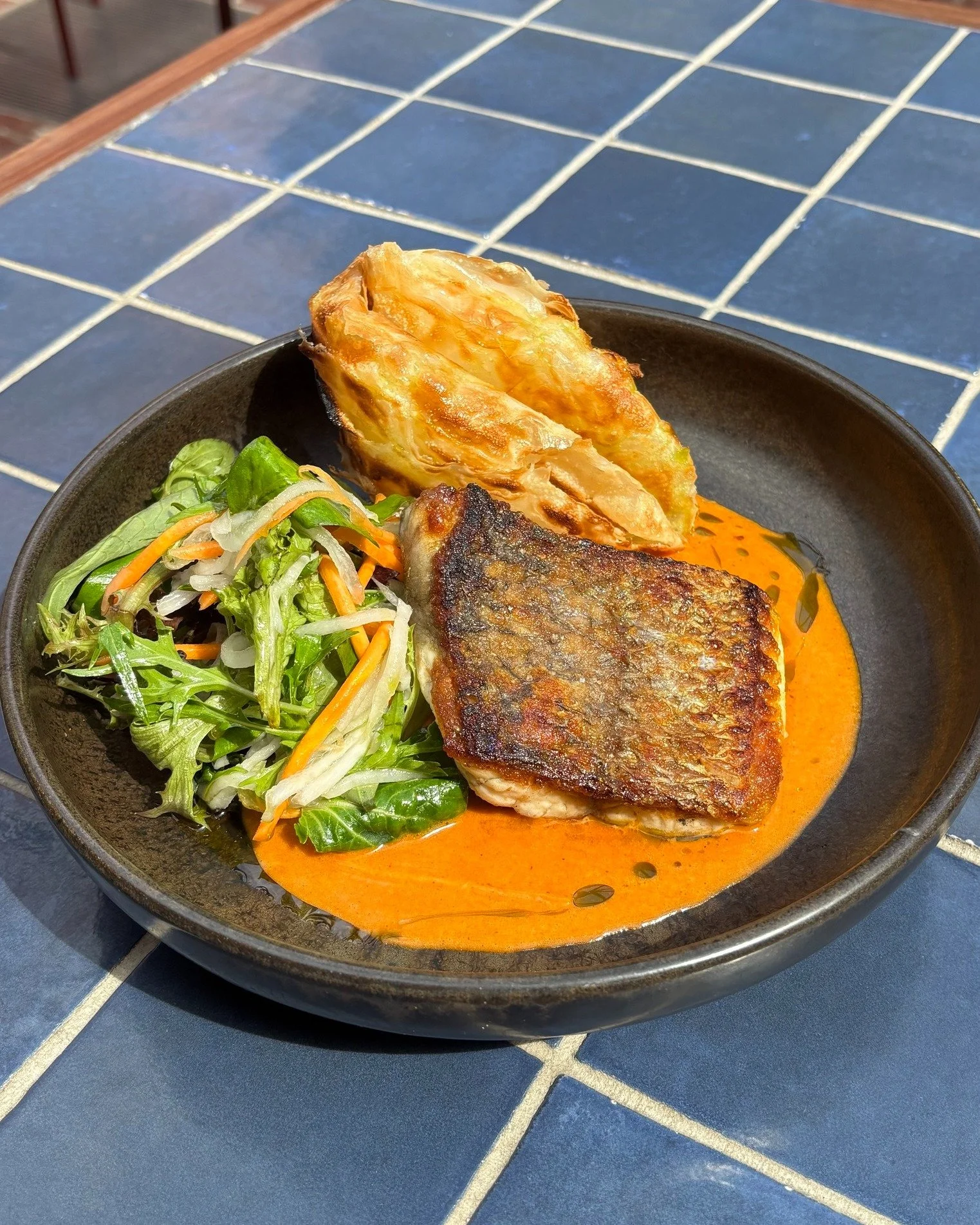 Our latest Market Fish dish is made for for these warmer days!

Pan-fried barramundi is paired with creamy coconut tikka masala, a crisp Asian-style salad and roti to scoop it all up.

Add a glass of white wine or an ice-cold beer and you've got the 